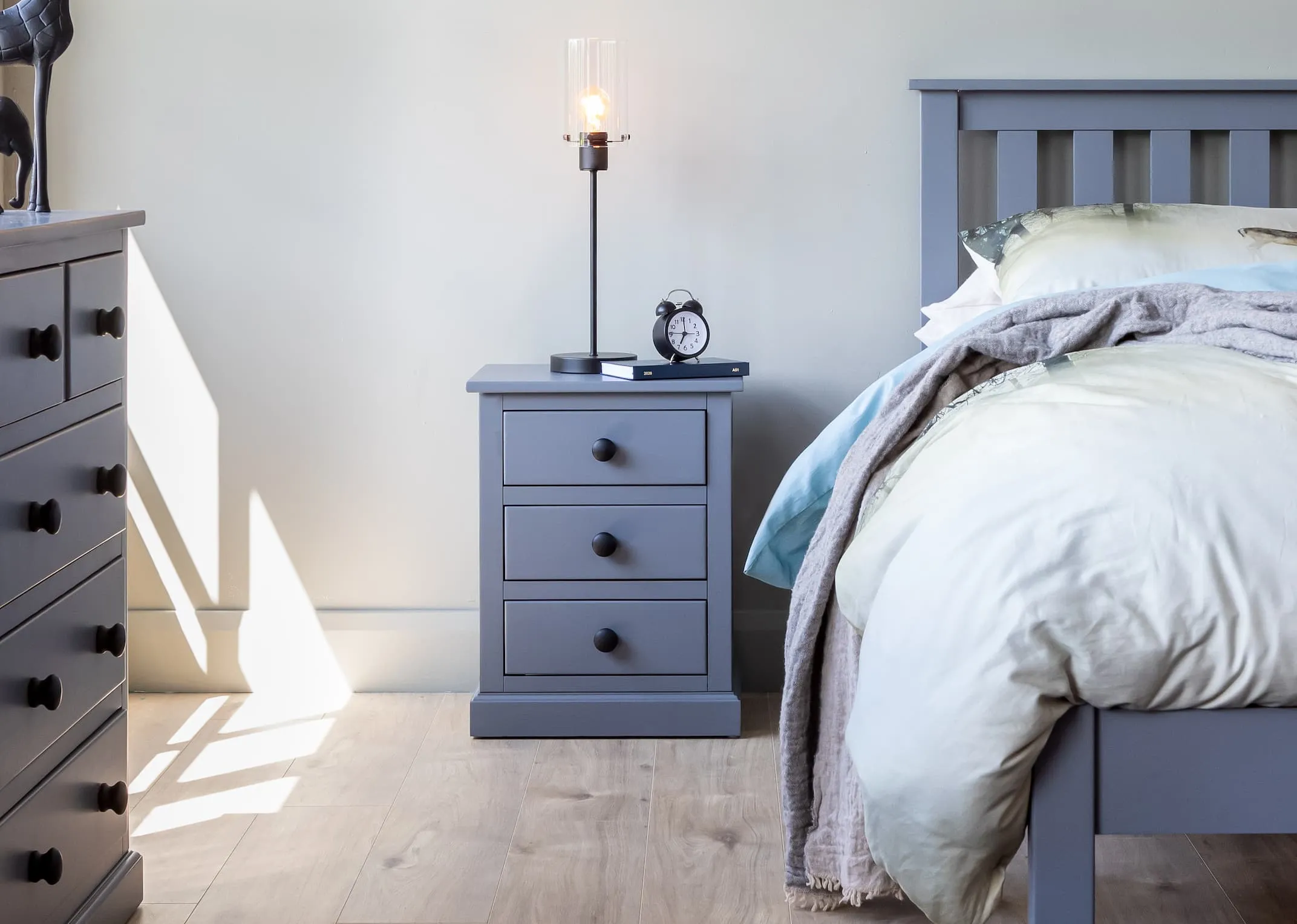 A lifestyle image of the Atlas locker with Karina lamp
