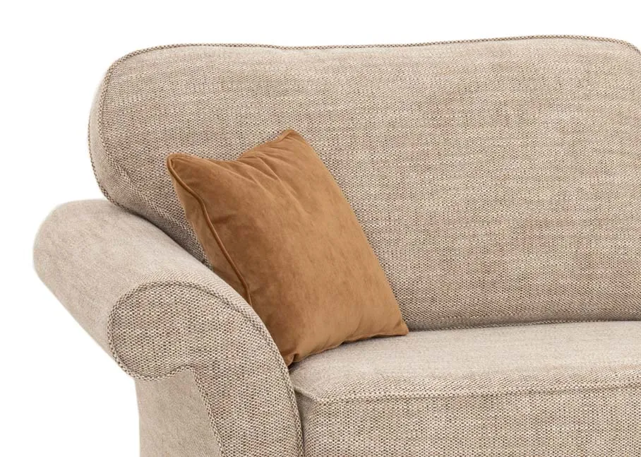 A 4 seater cream fabric sofa from EZ Livings Lauren range. Front view of curved sides and 2 gold cushions.