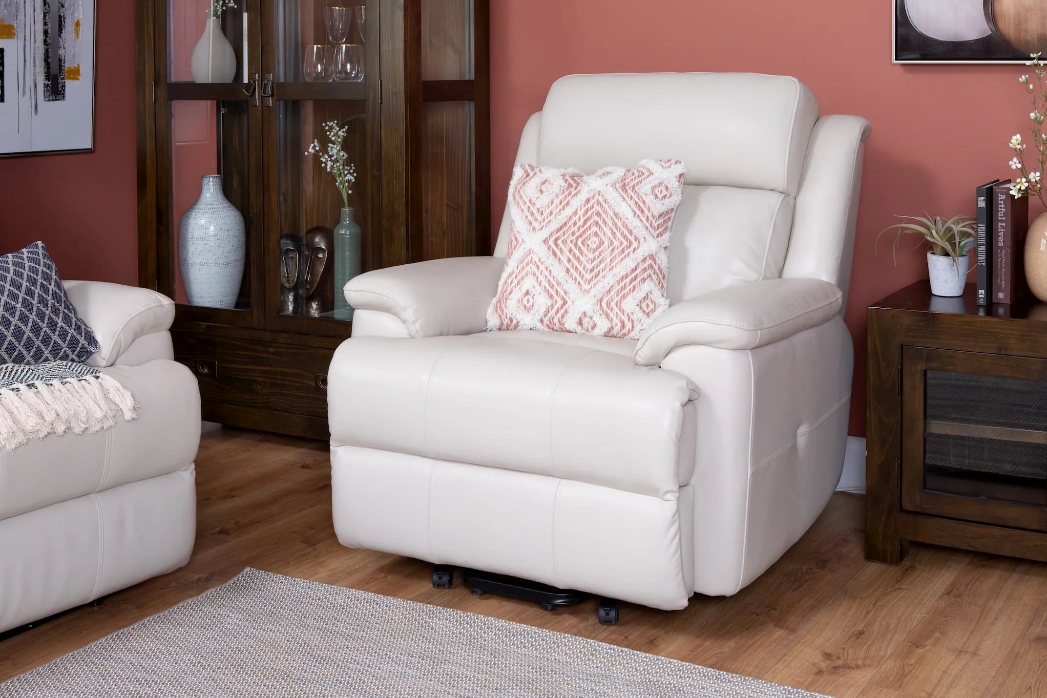 A lifestyle image of the Embrace Recliner with the Montreal display & console table from EZ Living Furniture