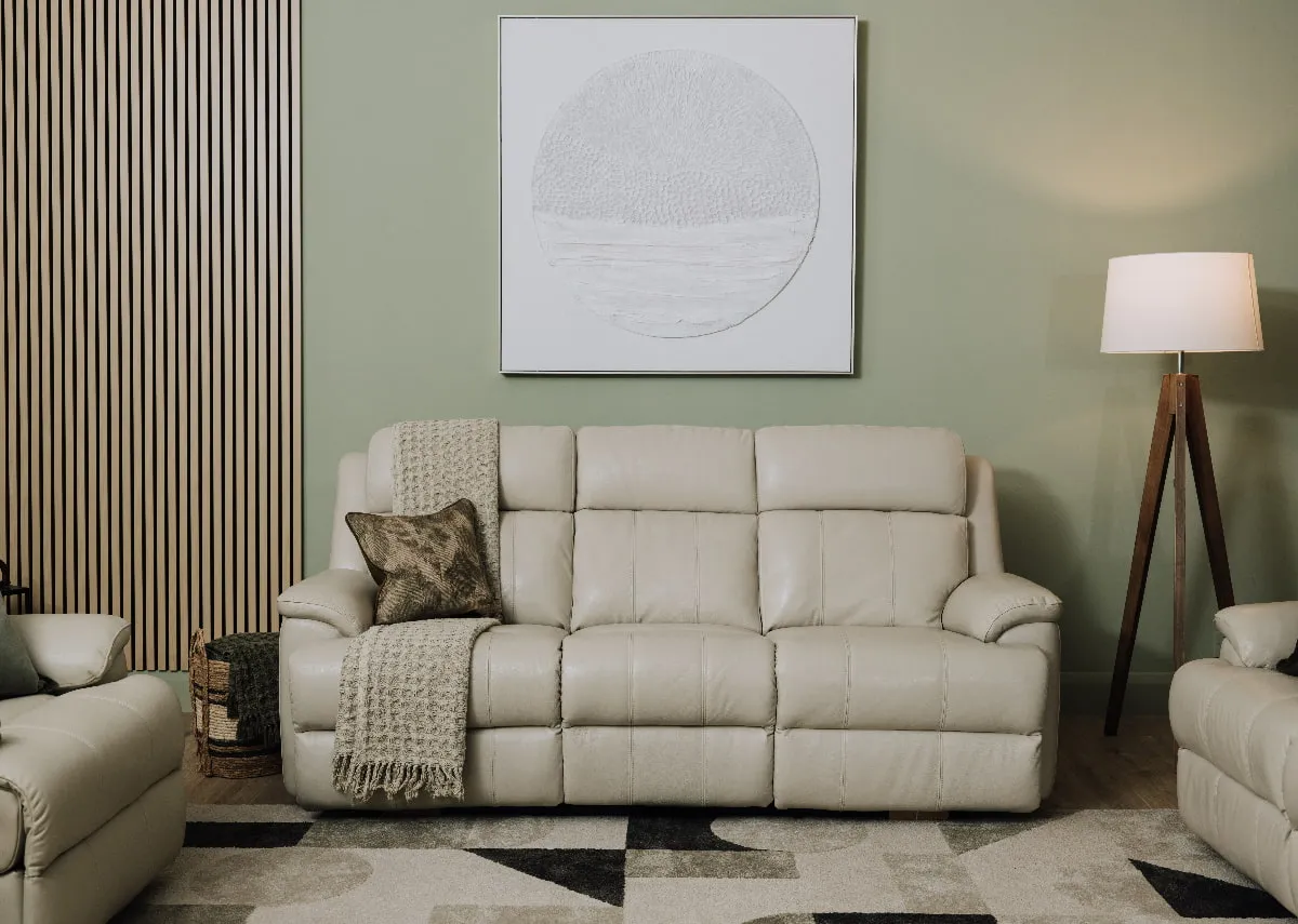 A 3 Seater power reclining sofa in white leather from EZ Living Furnitures Embrace range. Closeup of button function