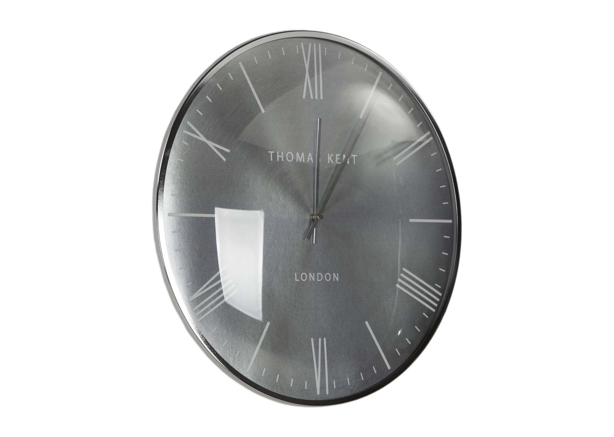 The Medium Silver Oyester wall clock from the Thomas Kent collection at EZ  Living Furniture - angle view