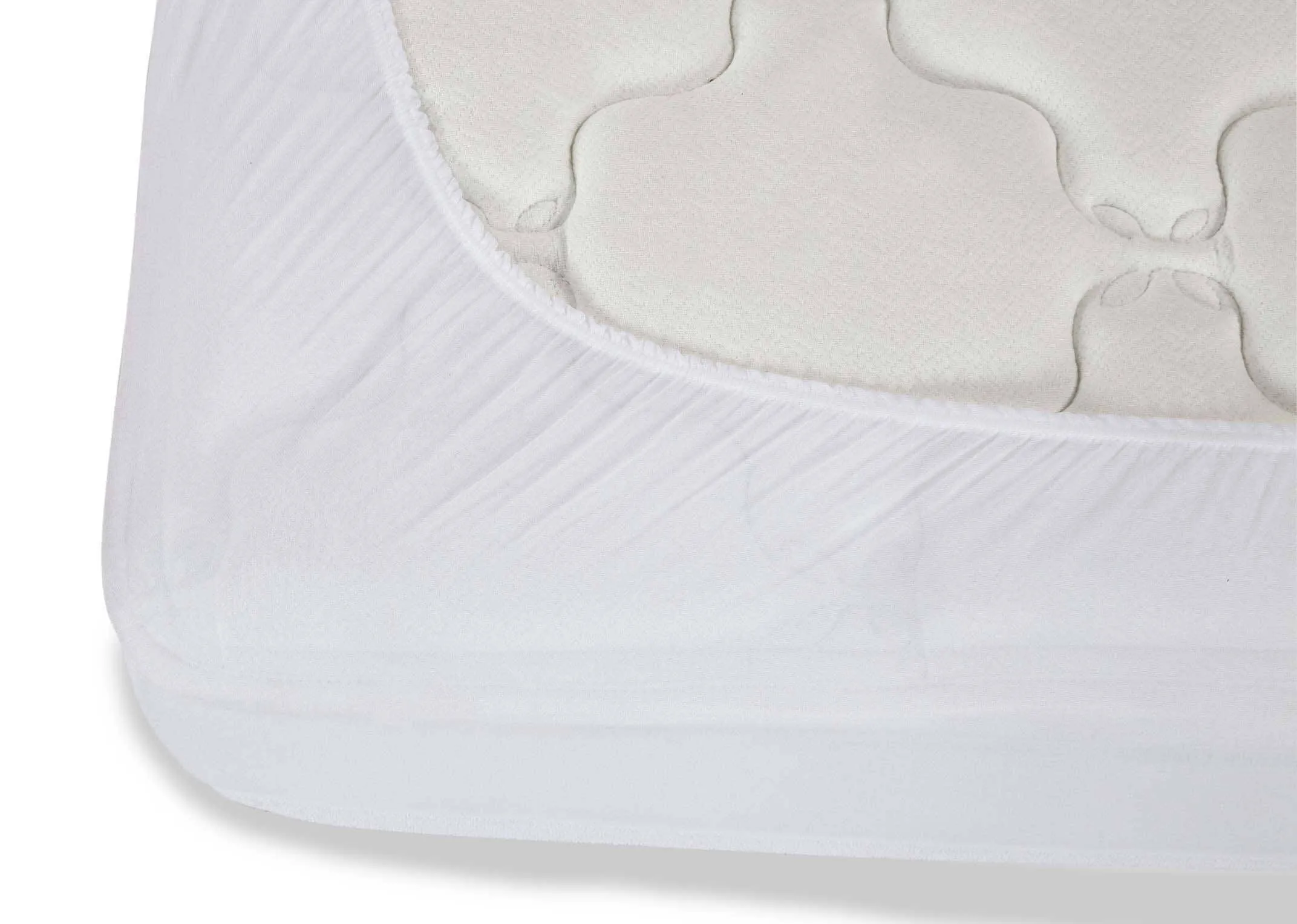 The Guardsman King Size 5ft mattress protector fitted on a mattress. Closeup of fit of underlay