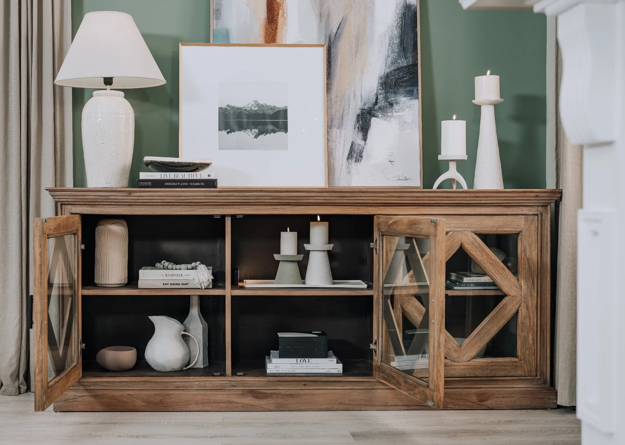 A lifestyle image of the Tristan Sideboard with a selection of accesories displayed including the Tolka lamp.