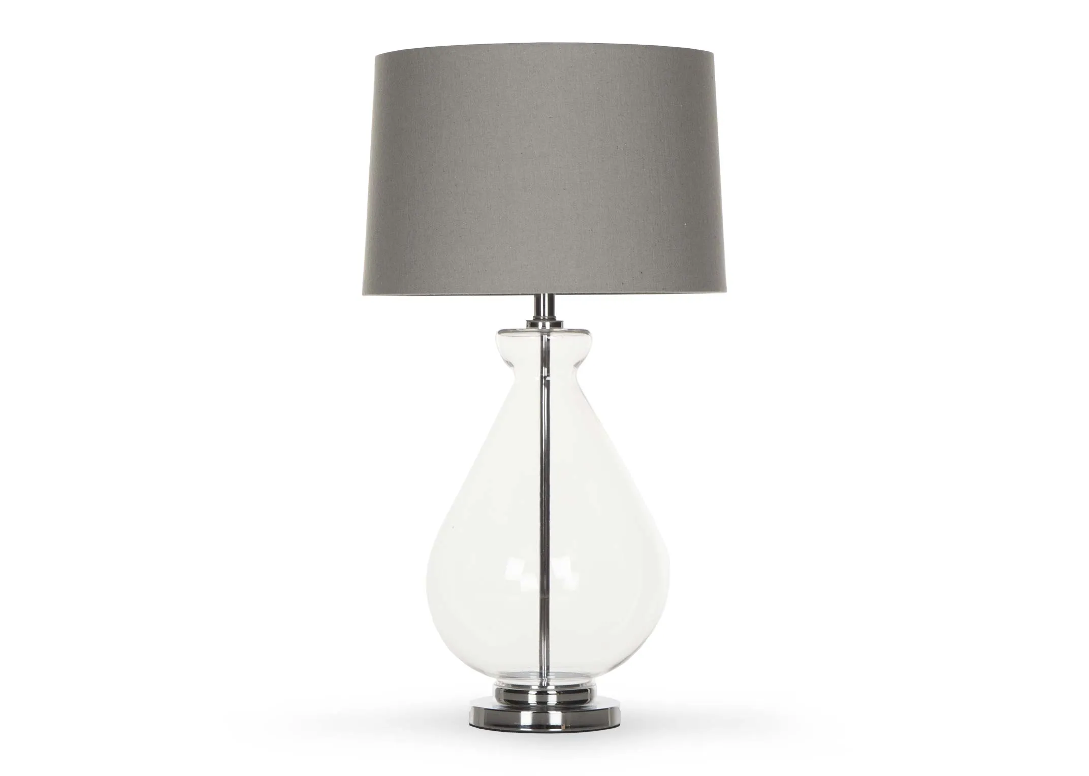 A clear based table lamp with silver fittings & grey barrel shade from EZ Living Furniture's Bree range. Front view of lamp.