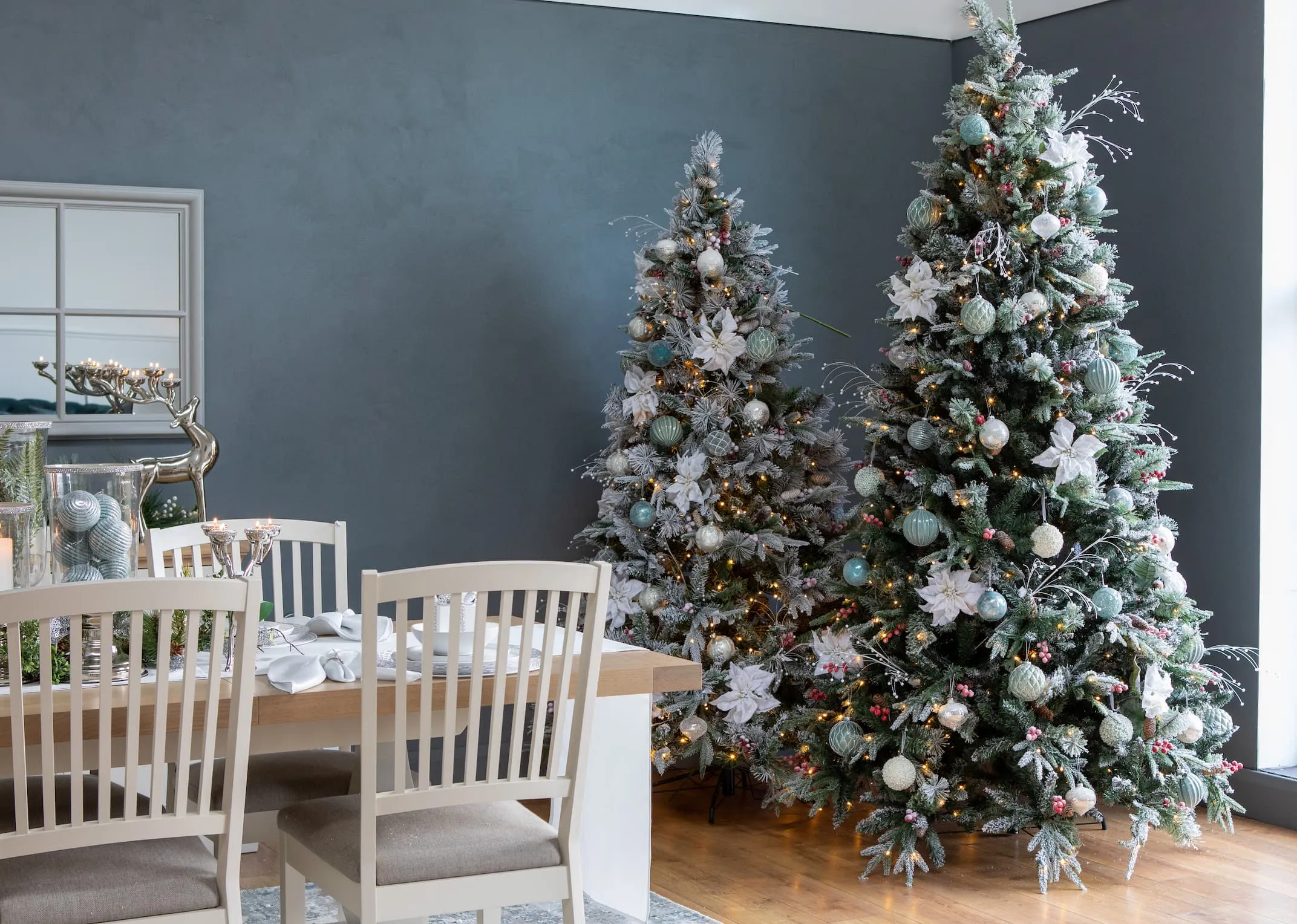 A lifestyle image of the Vermont snow trees with Sonoma dining range & blue with Rhinestone decor