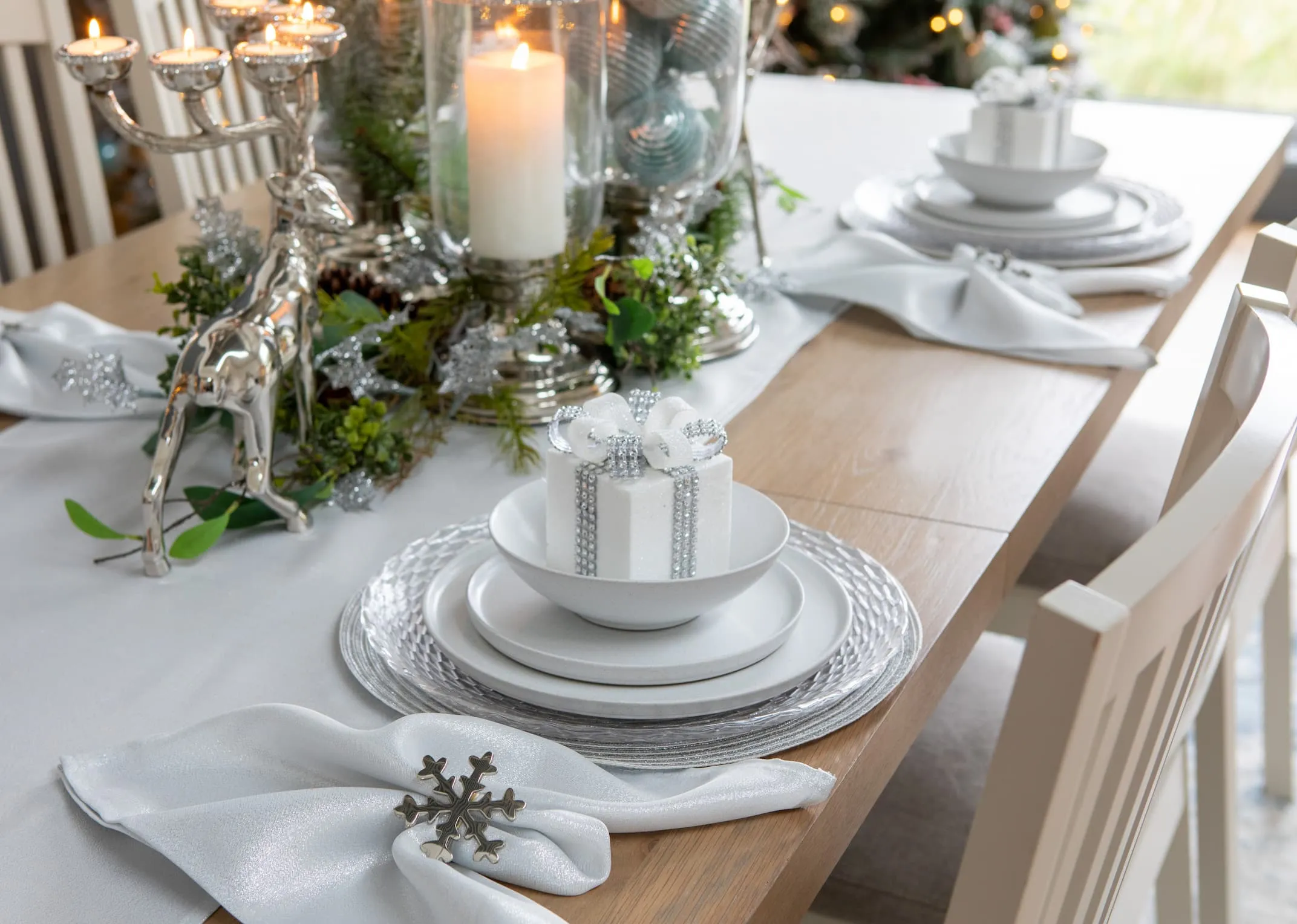 A lifestyle image of the Sonoma dining range with Reindeer candle holder & Xmas present box in bowl.