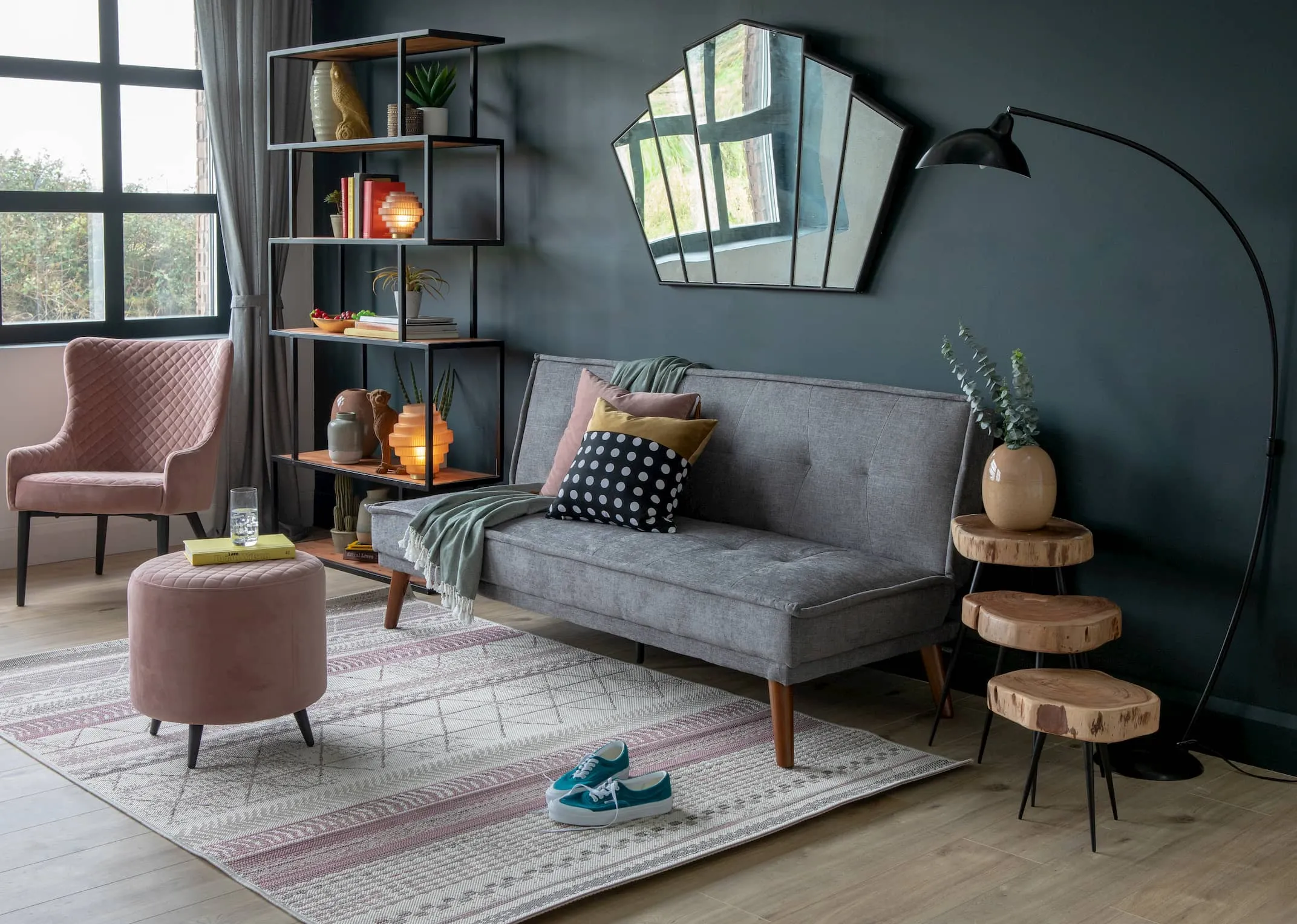 A lifebstyle image of the Seattle Grey Sofa bed with Ottowa Pink Lounge & footstool & fiji tables