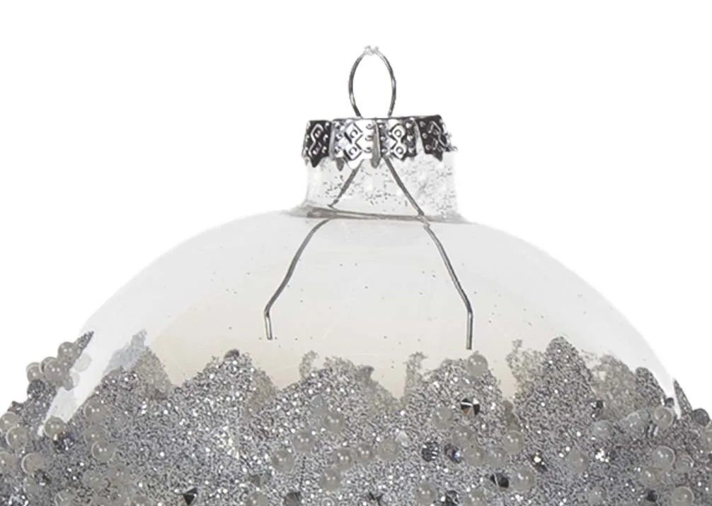 A clear glass bauble with silver encrusted detail in middle from EZ Living Furniture's Christmas collection. Closeup detail.