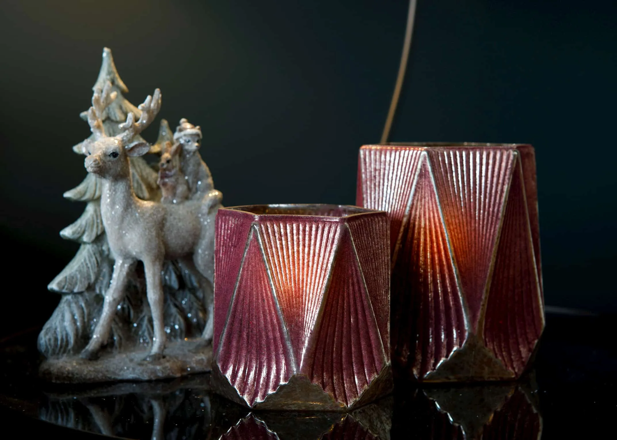 A red glass geometric shape candle holder with white edging from EZ Living Furniture's Christmas range. Closeup view inside