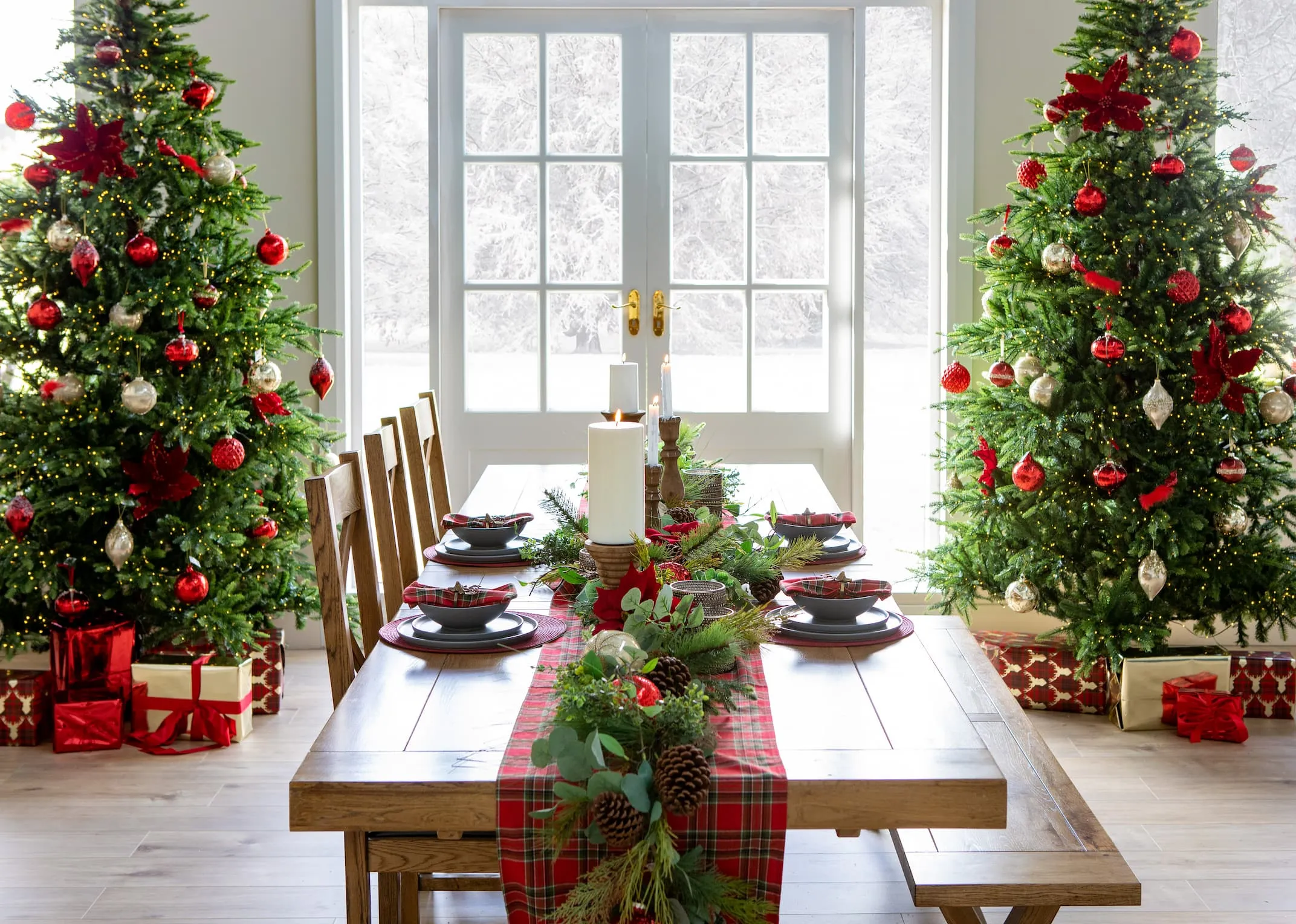 A lifestyle image of the Athens Dining range with Rockefeller trees decorated in a red theme