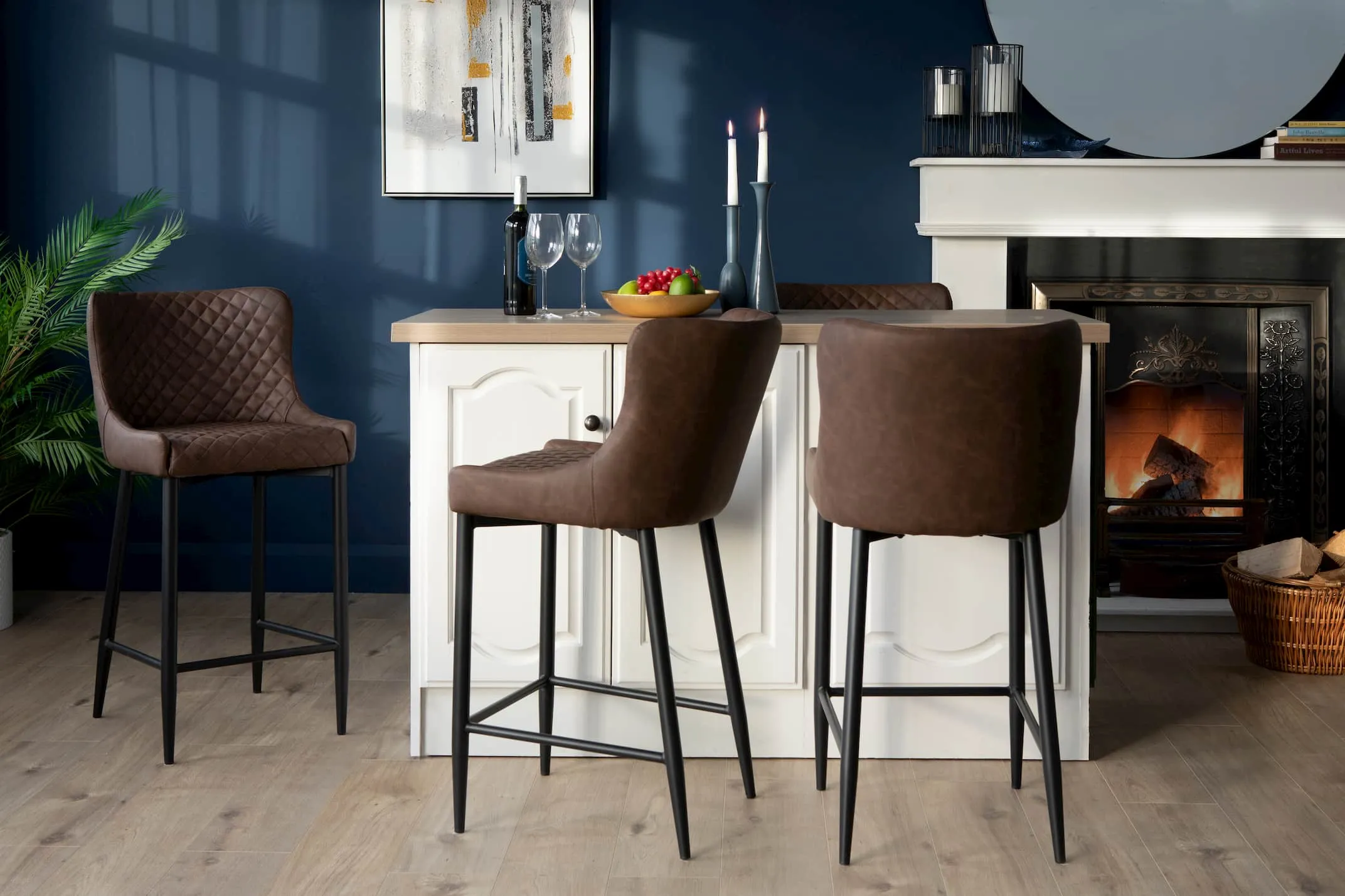A lifestyle image of the Ottowa Brown faux leather stool with a kitchen island setting