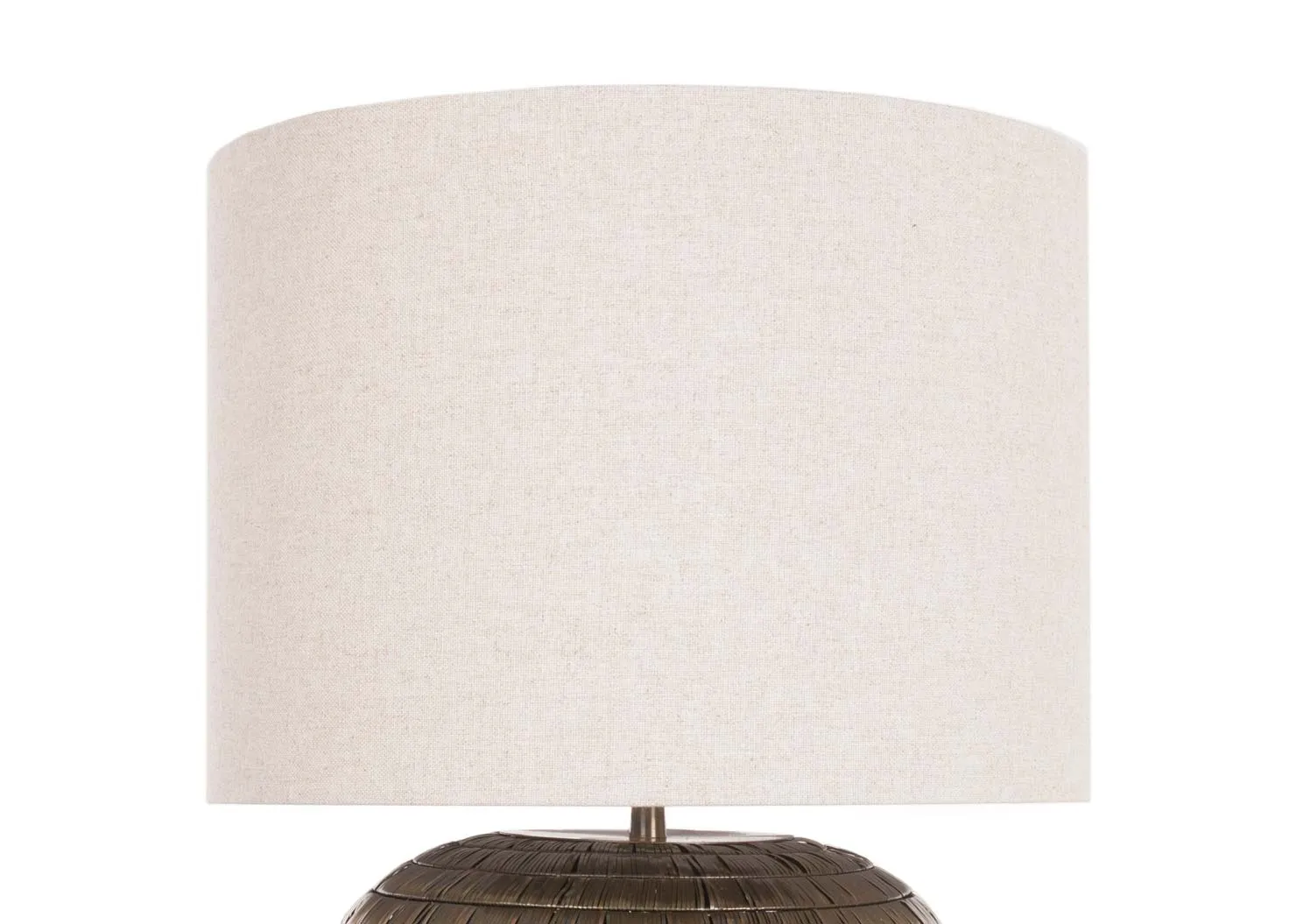 A bronze round lamp base with natural drum shade from EZ Living Furniture's Kymori range. Closeup of the cream shade