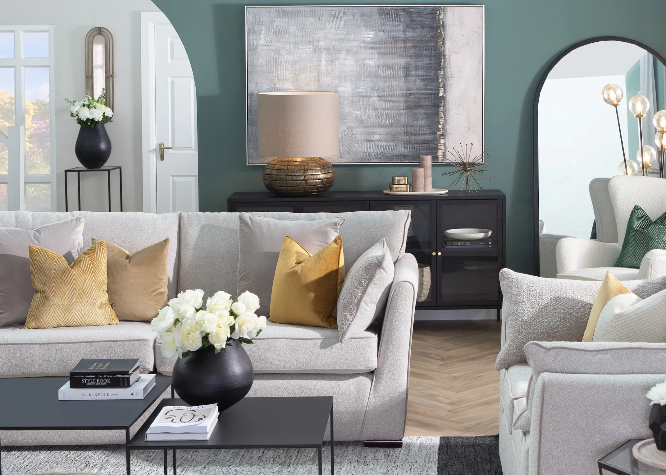 A lifestyle image of the Santorini sofa with Pebble furniture & Kymori lamp on the Carmel Sideboard.