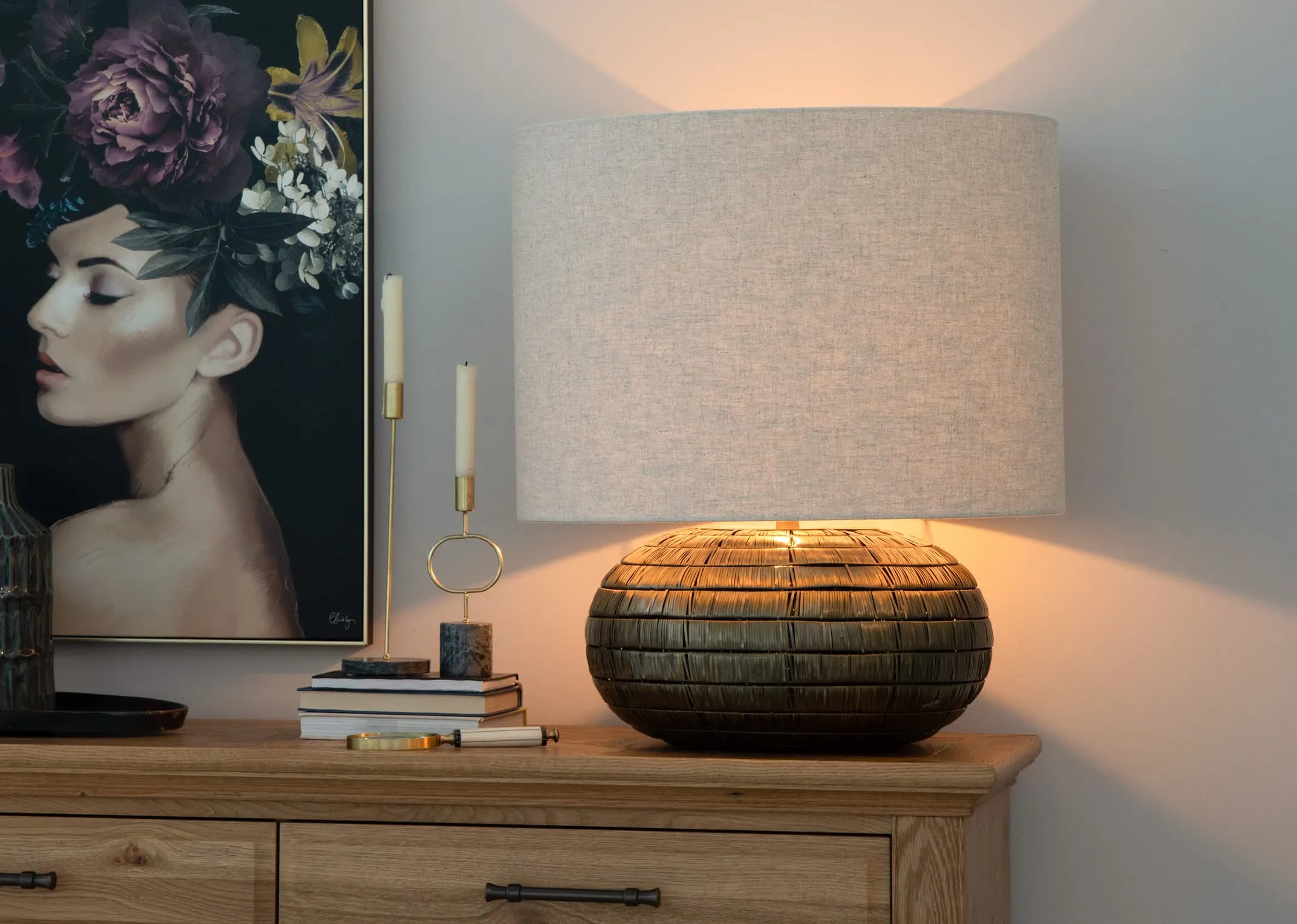 A lifestyle image of the Kymori Lamp switched on with the Lily Canvas