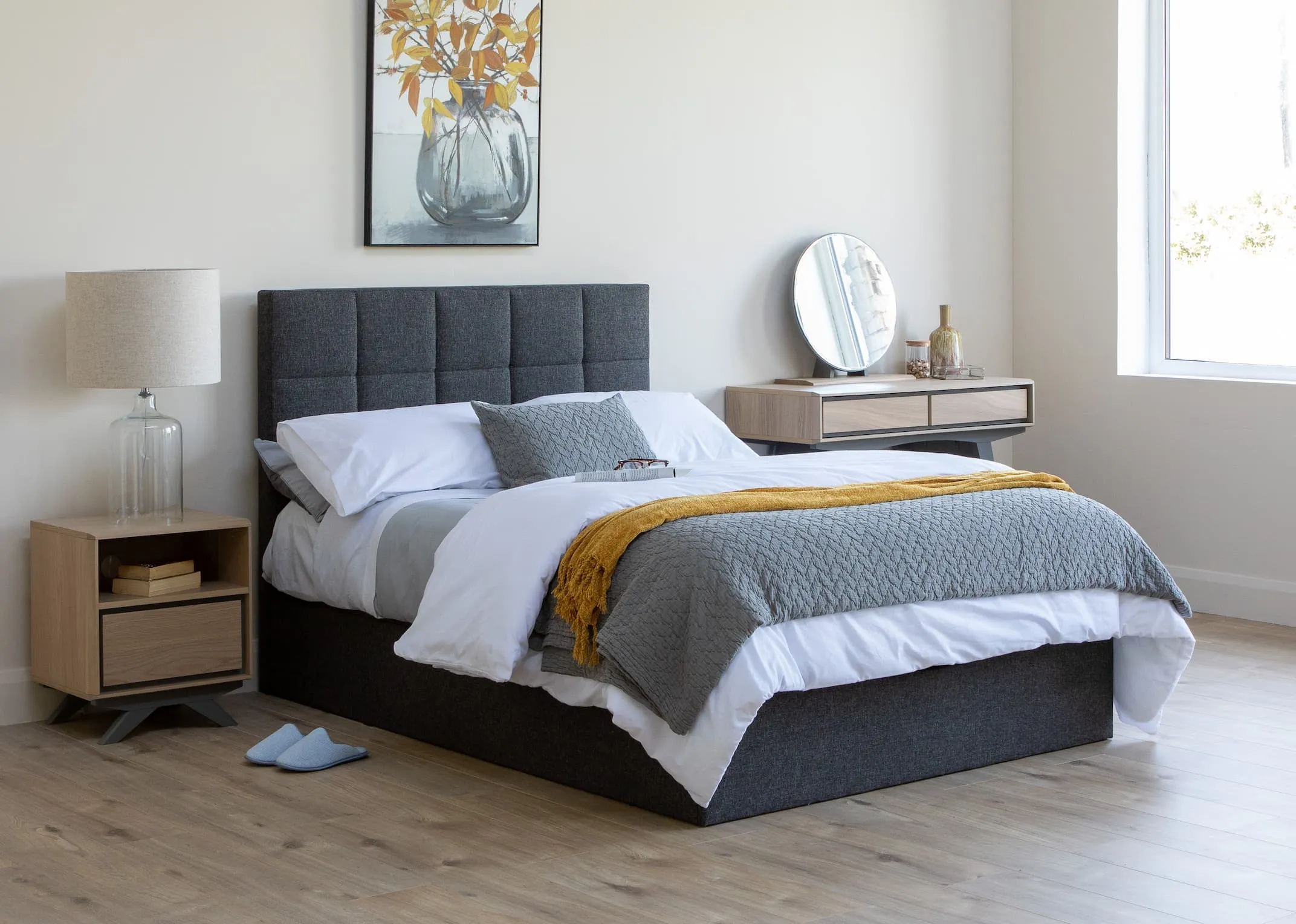 A lifestyle image of the Ottoman Bed with Brunel Vanity & locker & crystal canvas