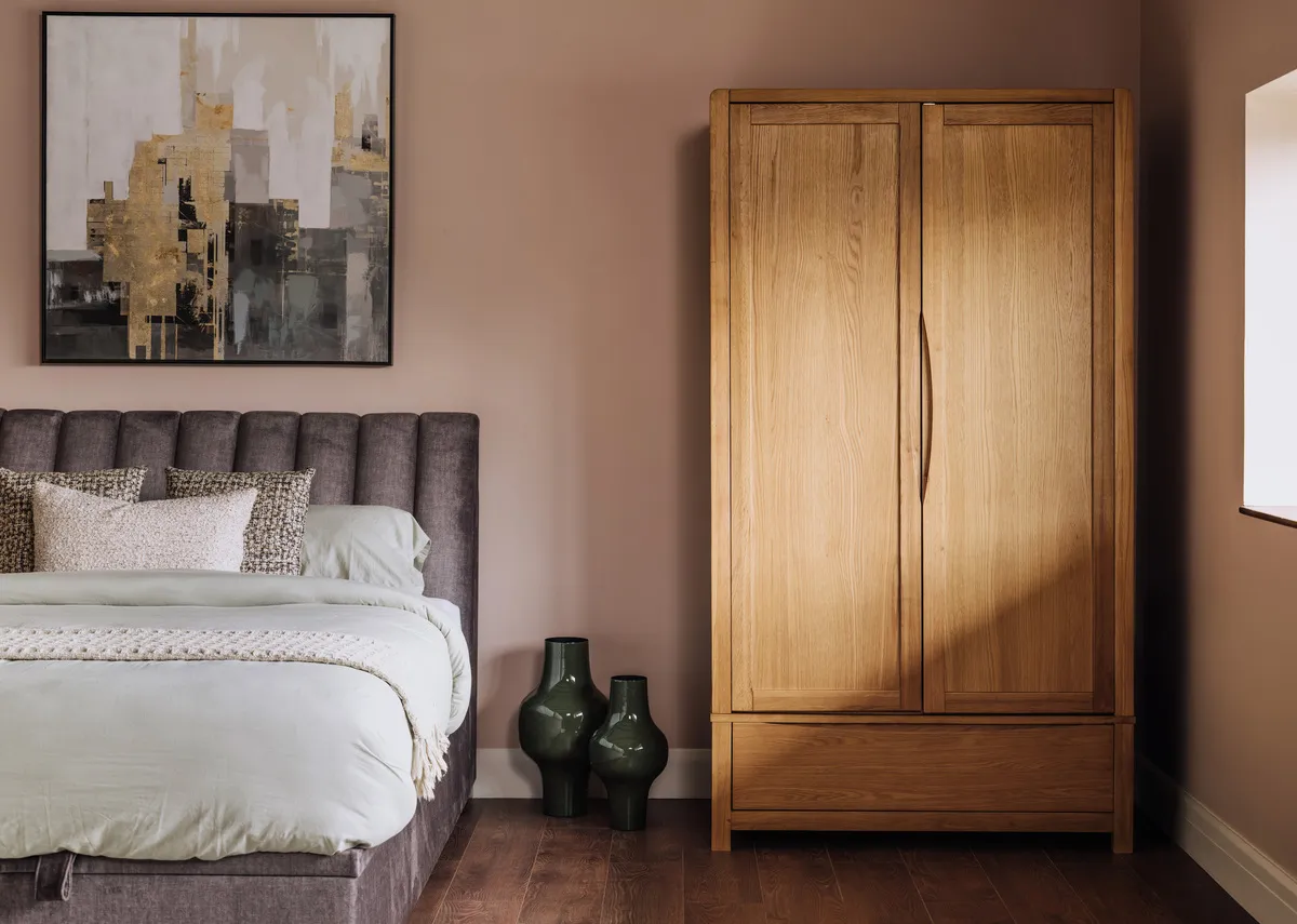 A 2 door oak wardrobe from EZ Livings Iris range.Front view of wardrobe with doors open