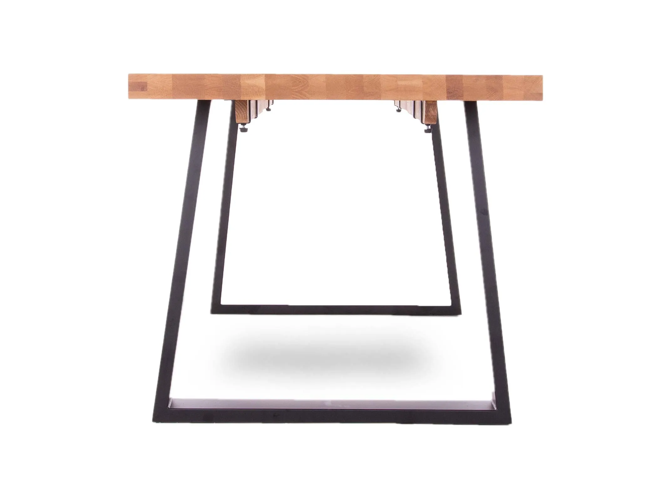 A 200cm oak dining table with metal legs from EZ Living Furniture's Renvyle range. Side view of metal legs