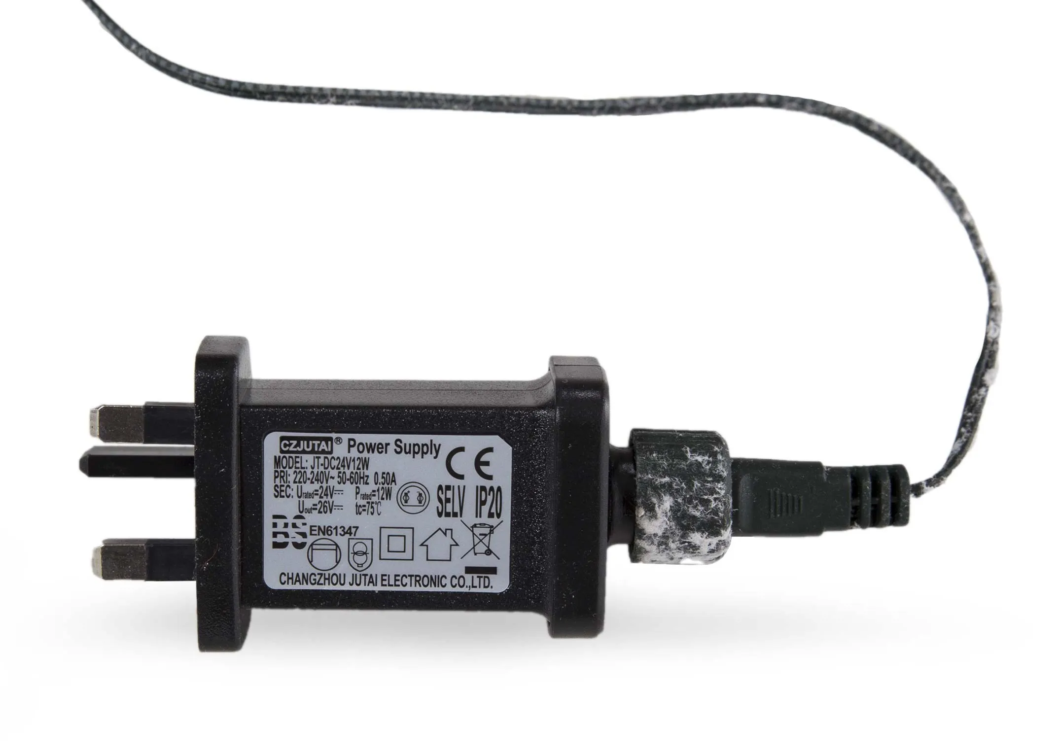 An LED lit berry & pine 7ft Christmas tree from EZ Living Furniture's Vermont range. Closeup pf plug