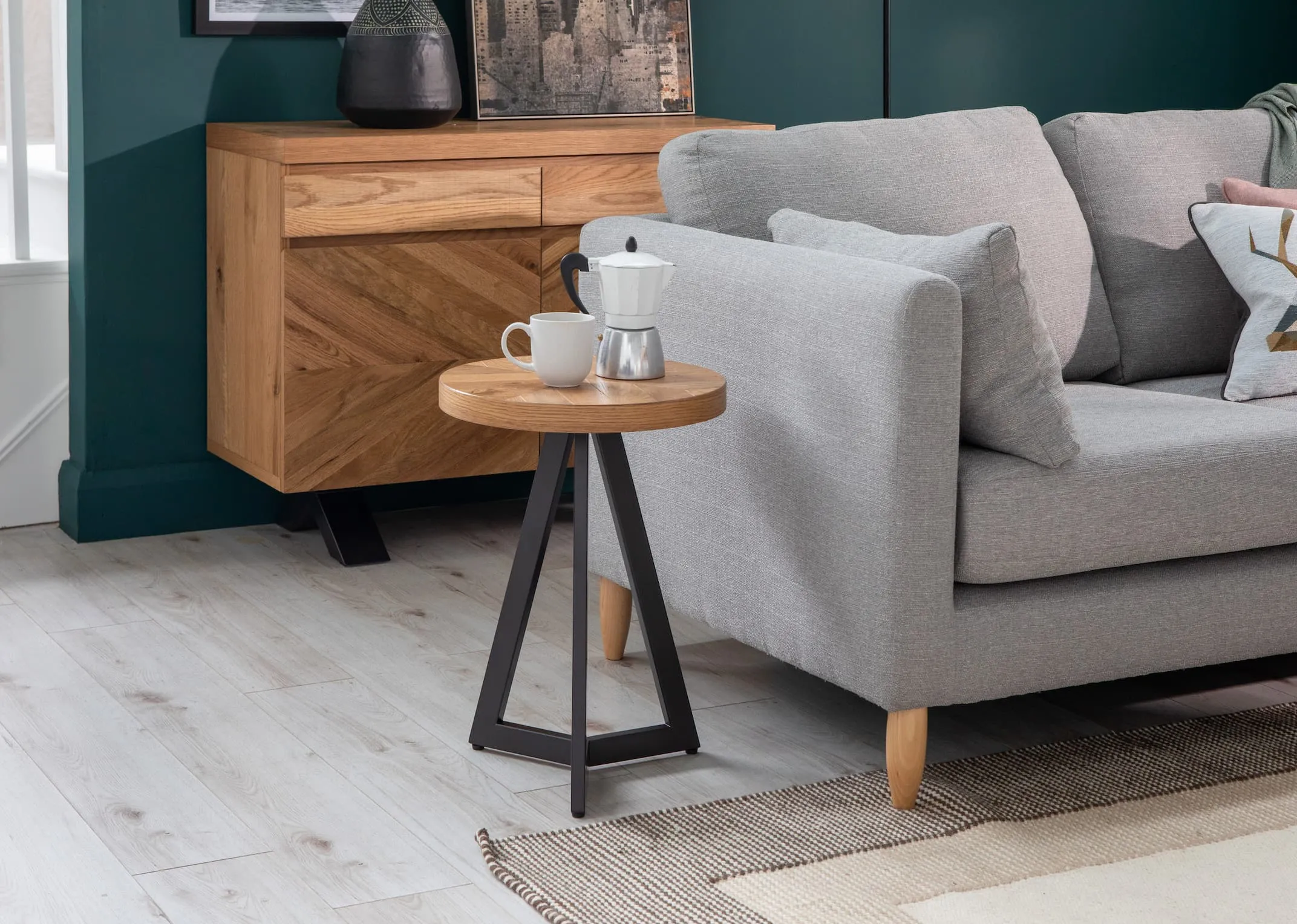 A lifestyle image of the Alamo sofas with Ellipse lamp table and calvin rug
