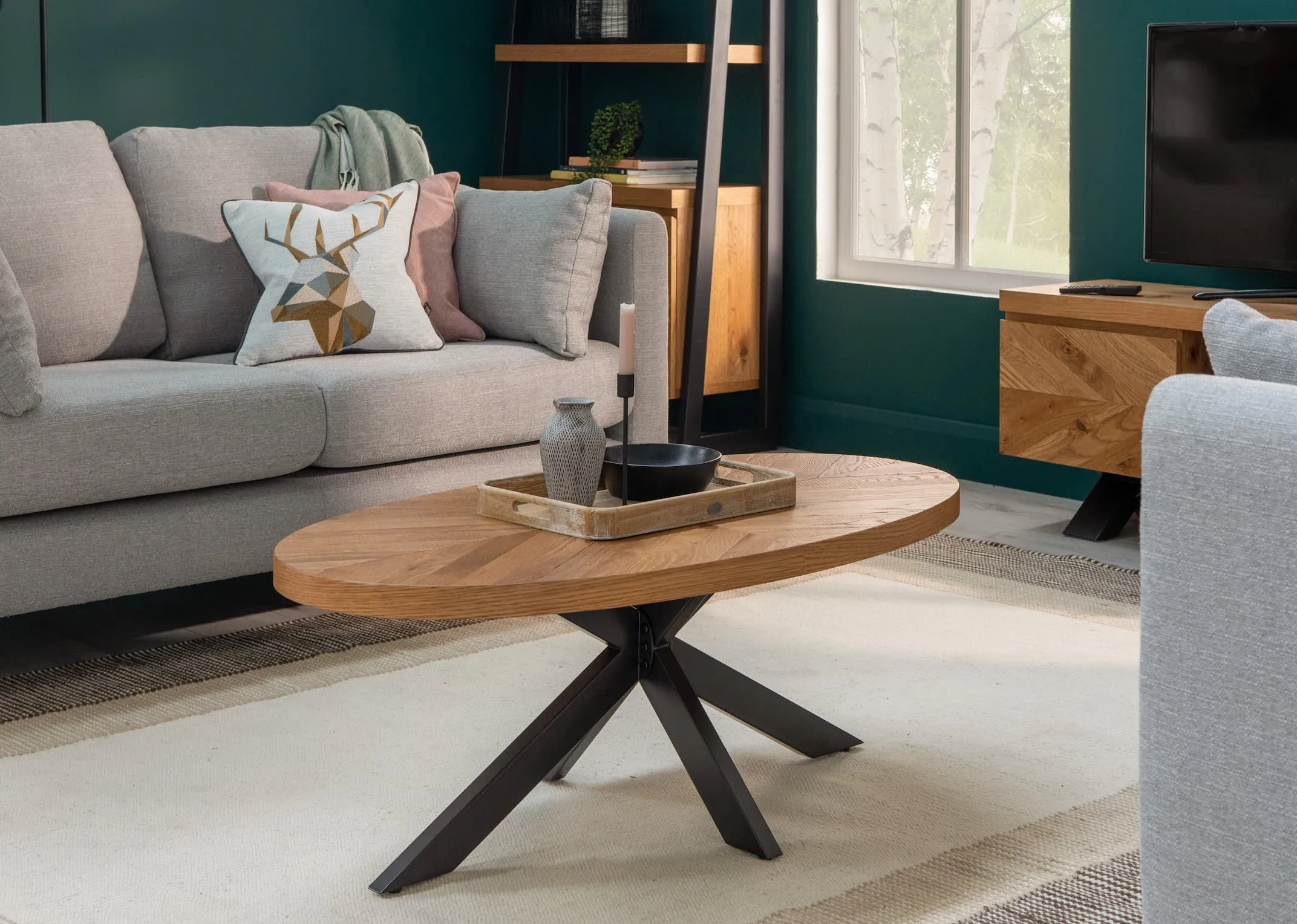 A lifestyle image of the Alamo sofas with Ellipse coffee table and calvin rug