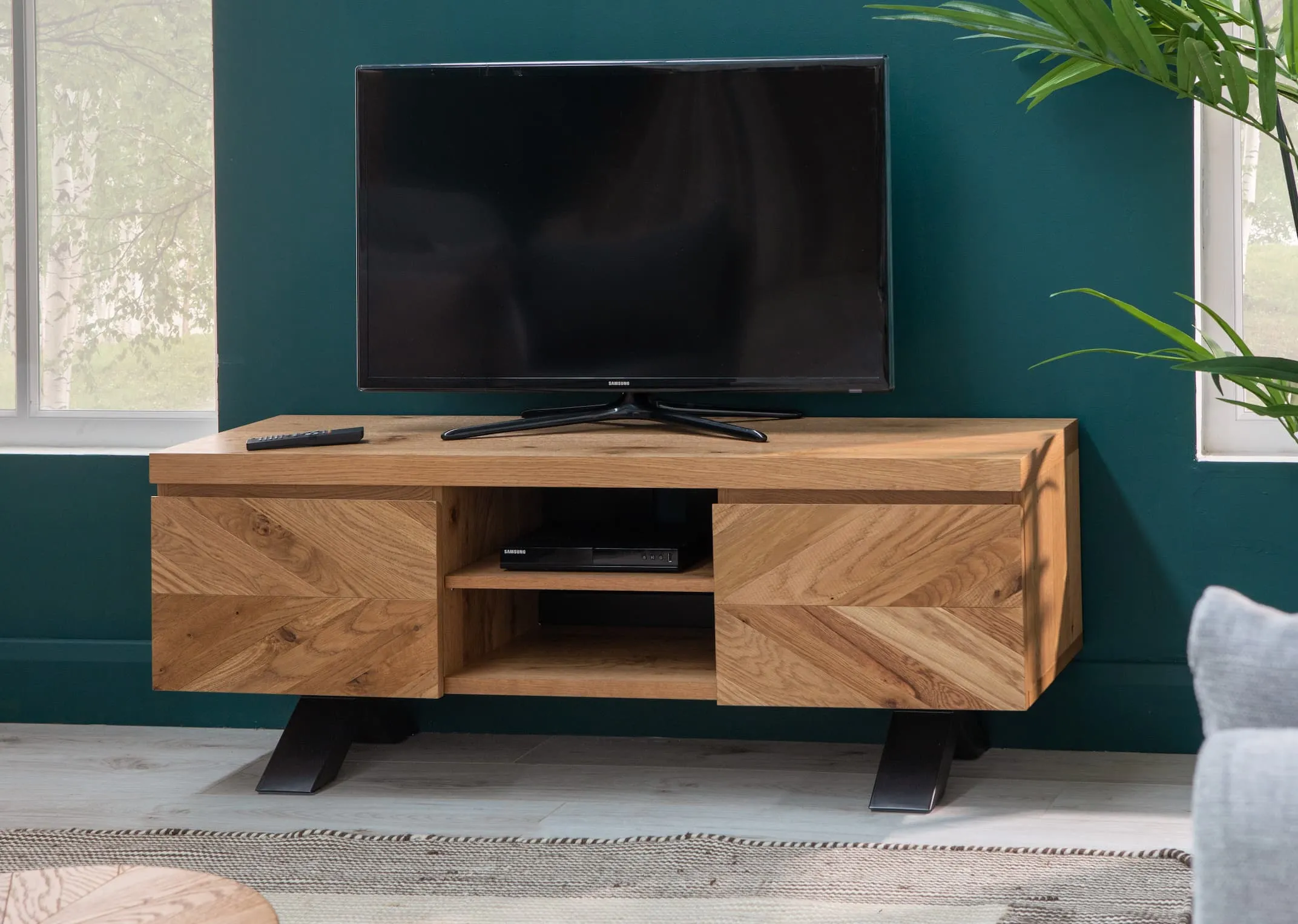 A lifestyle image of the Ellipse tv unit with tv from EZ Living Furniture.