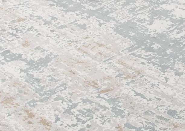 An ivory grey distressed medium rug from EZ Living's Modesto range. Closeup of faded texture