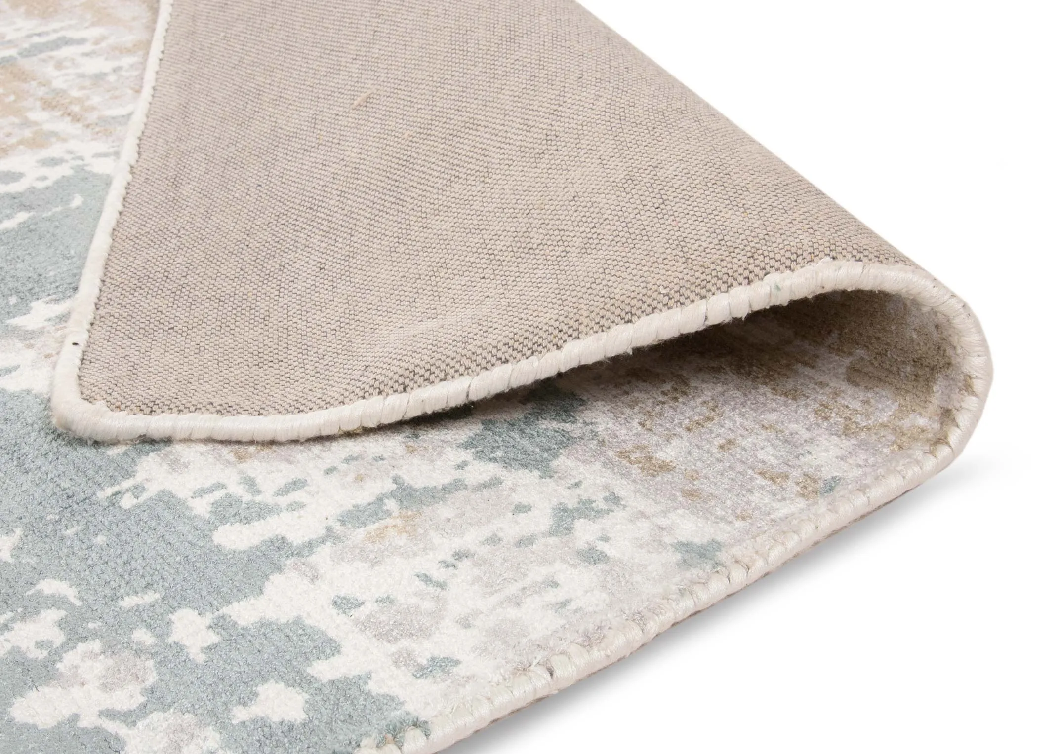 An ivory grey distressed large rug from EZ Living's Modesto range. Angled view of rug