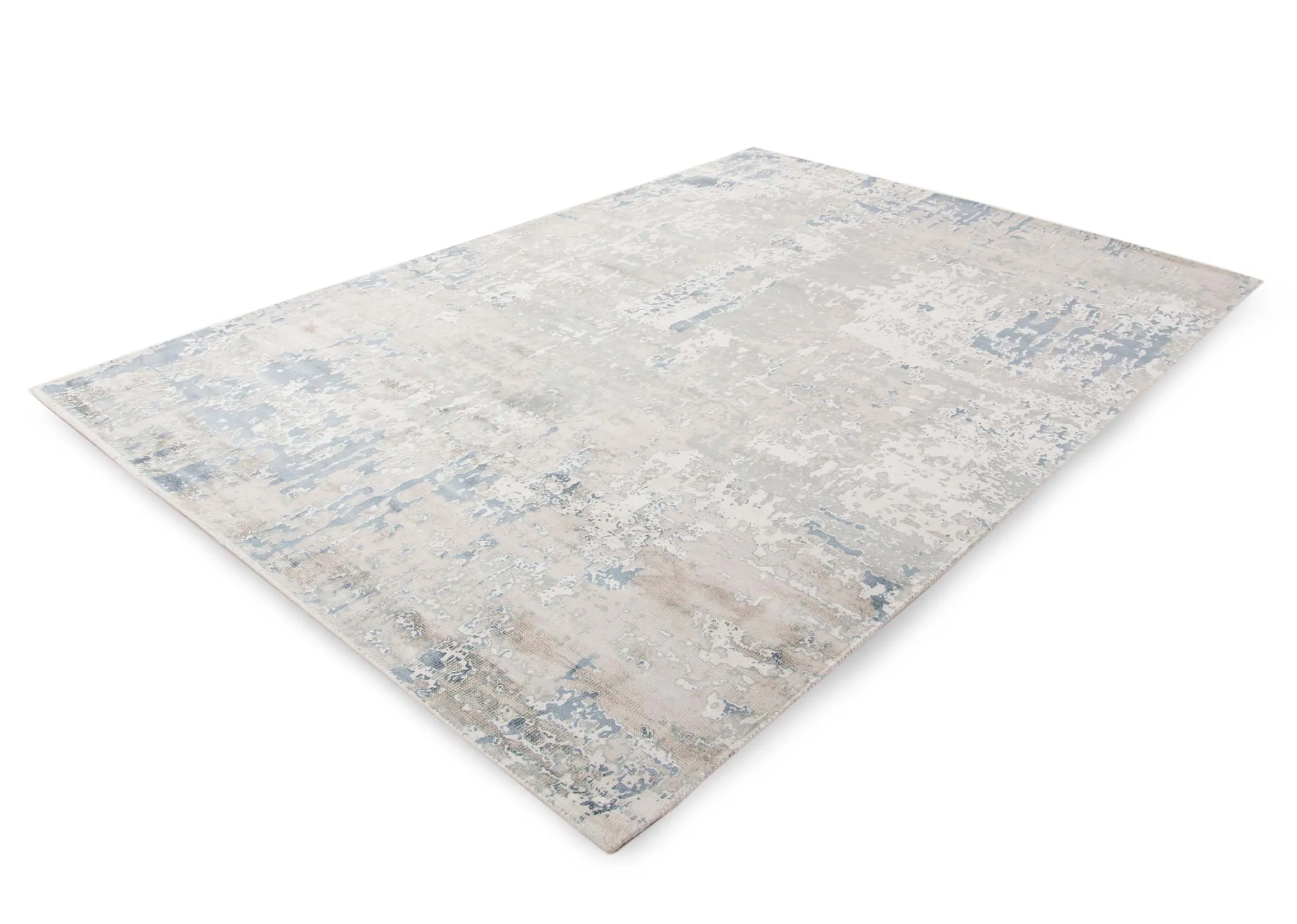 A large blue & silver distressed rug from EZ Living's Moderno range. Angled view of the rug
