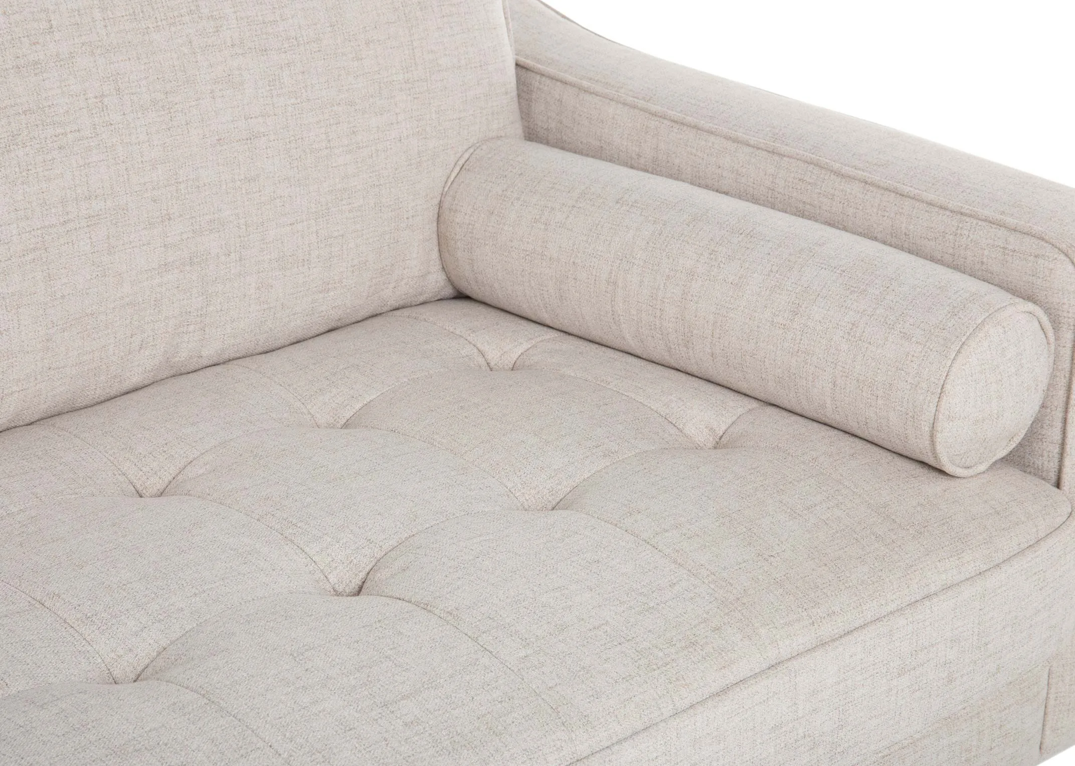A cream fabric Corner Chaise from EZ Living Furniture's Genoa range. Closeup of bolster cushion and tufted seat