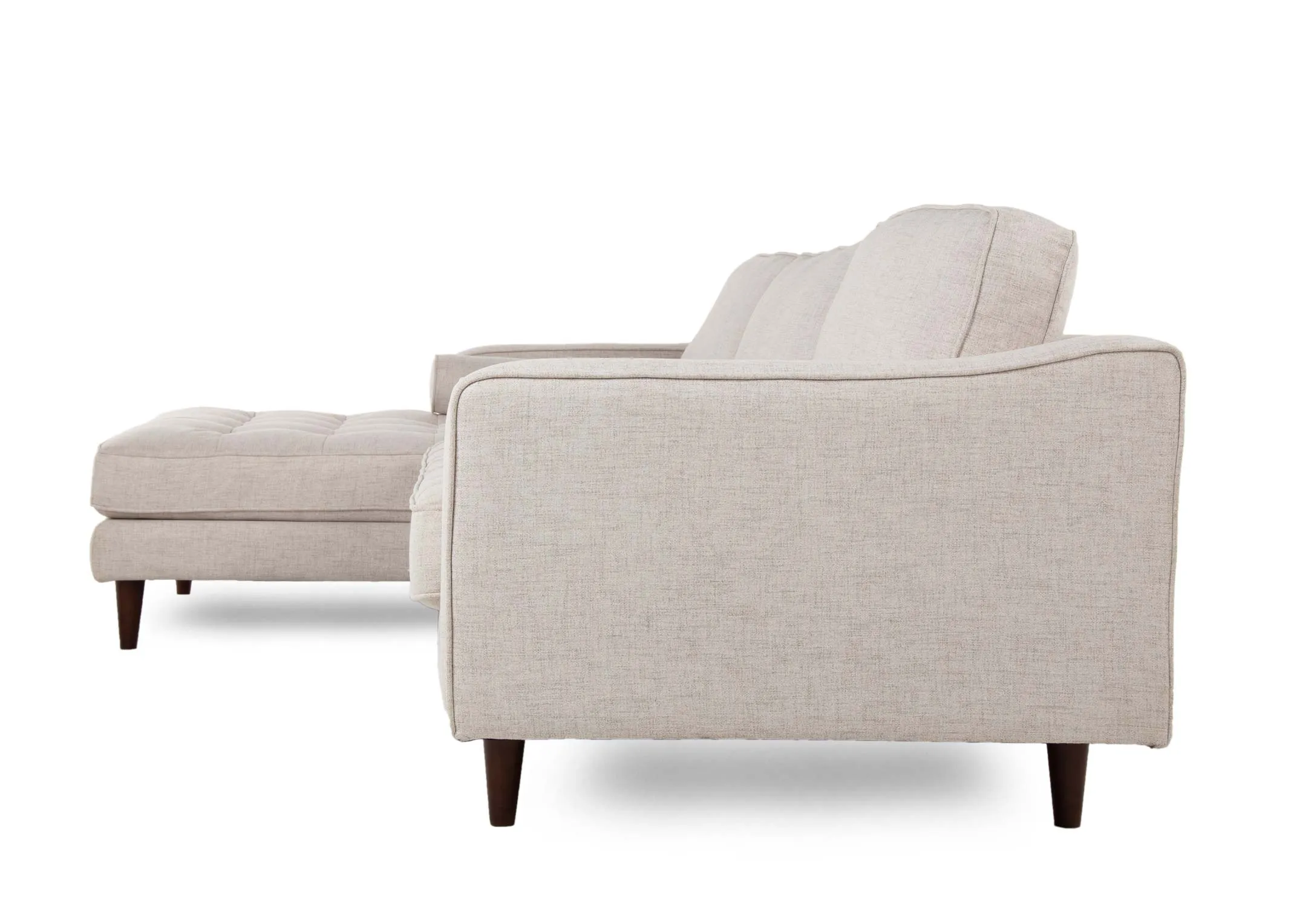 A cream fabric LHF corner chaise from EZ Living's Genoa range.Side view of dark feet