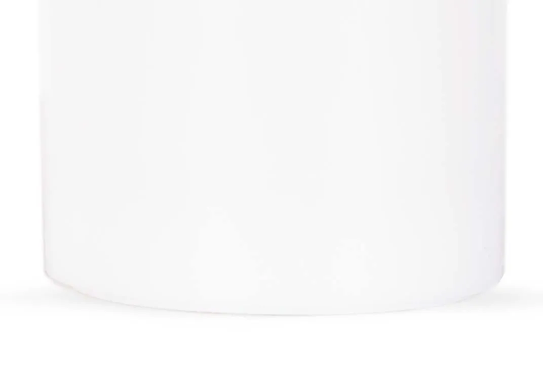 A small led white candle with lifelike flame from EZ Living Furniture's Deluxe Homeart range. Closeup of base texture