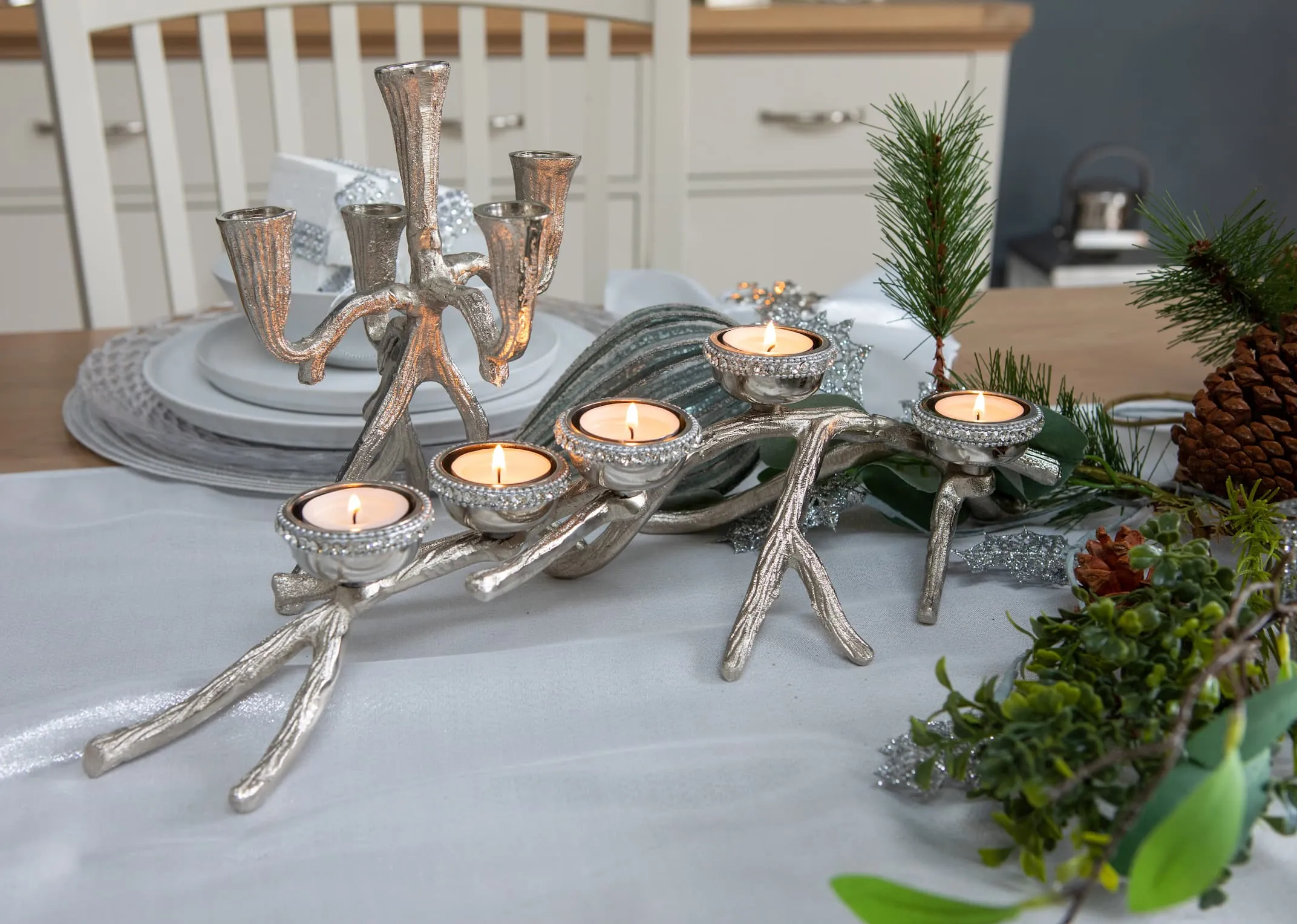 A lifestyle image of the 5 Rhinestone Branch on base design candle holder with Multi Stock candleholder