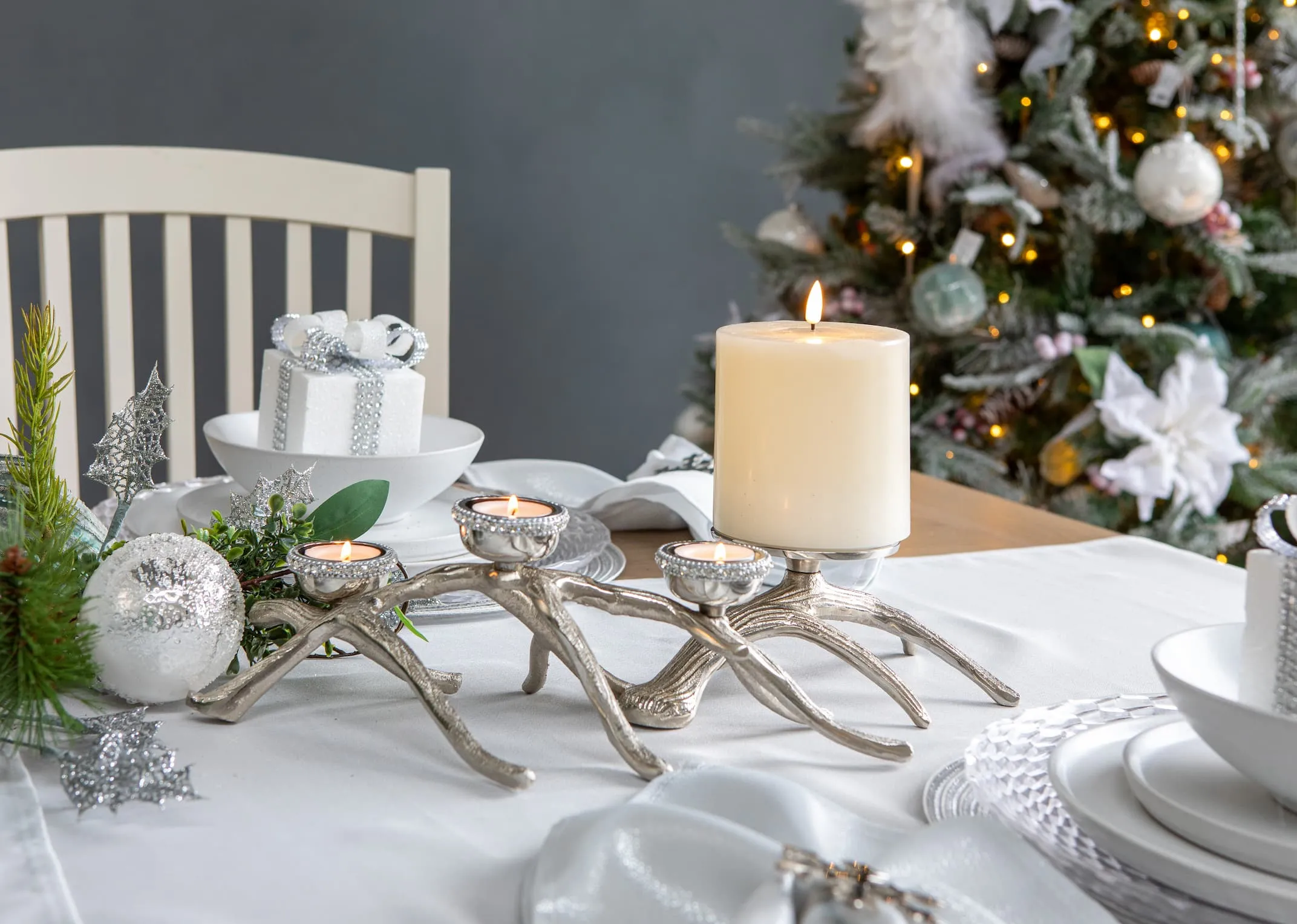 A lifestyle image of the 3 Rhinestone Branch on base design candle holder with Multi Stock candleholder