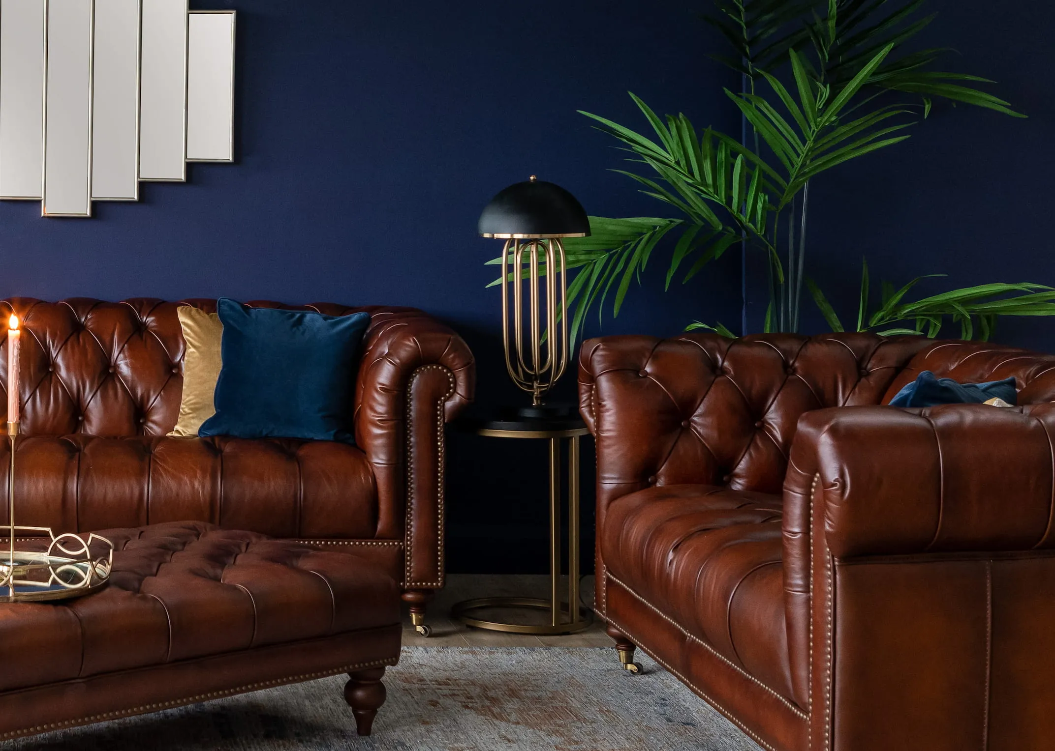 A lifestyle image of the Dixie lamp with chevron table & Adare sofas