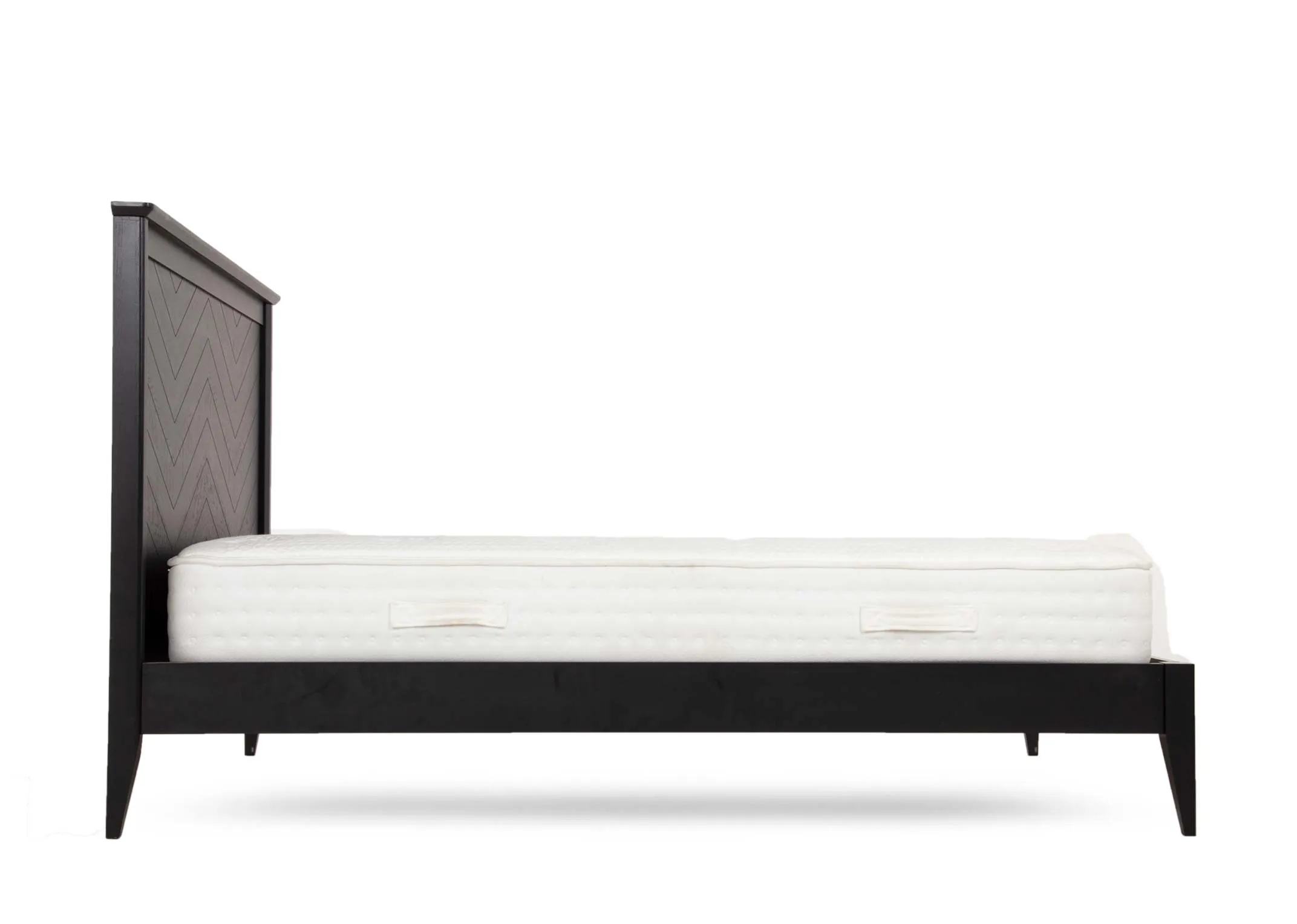 A king size 5ft black chevron oak & pine bedframe from EZ Living's Chevron range. Side view of bed with mattress & feet