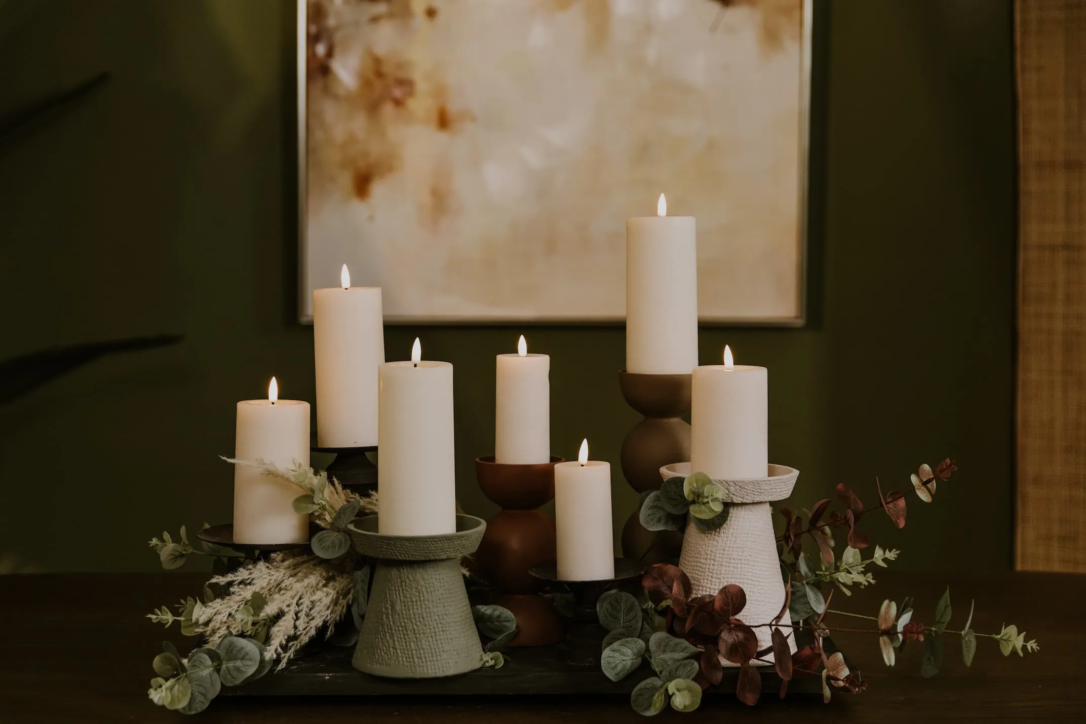 A lifestyle image of the Votive pastel candle holders withj a selection of LED Candles.
