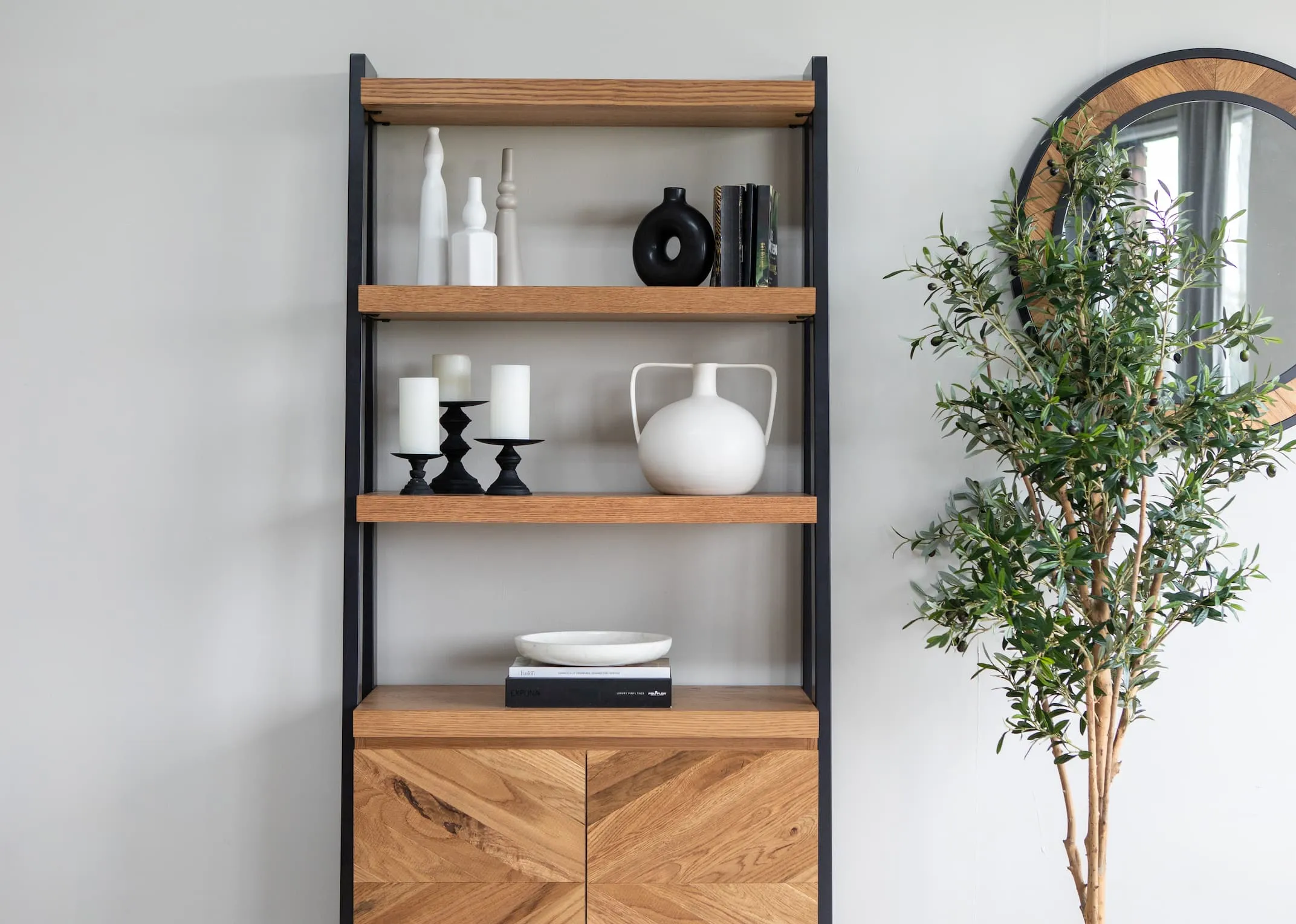 A lifestyle image of the Ellipse display & mirror with Camille