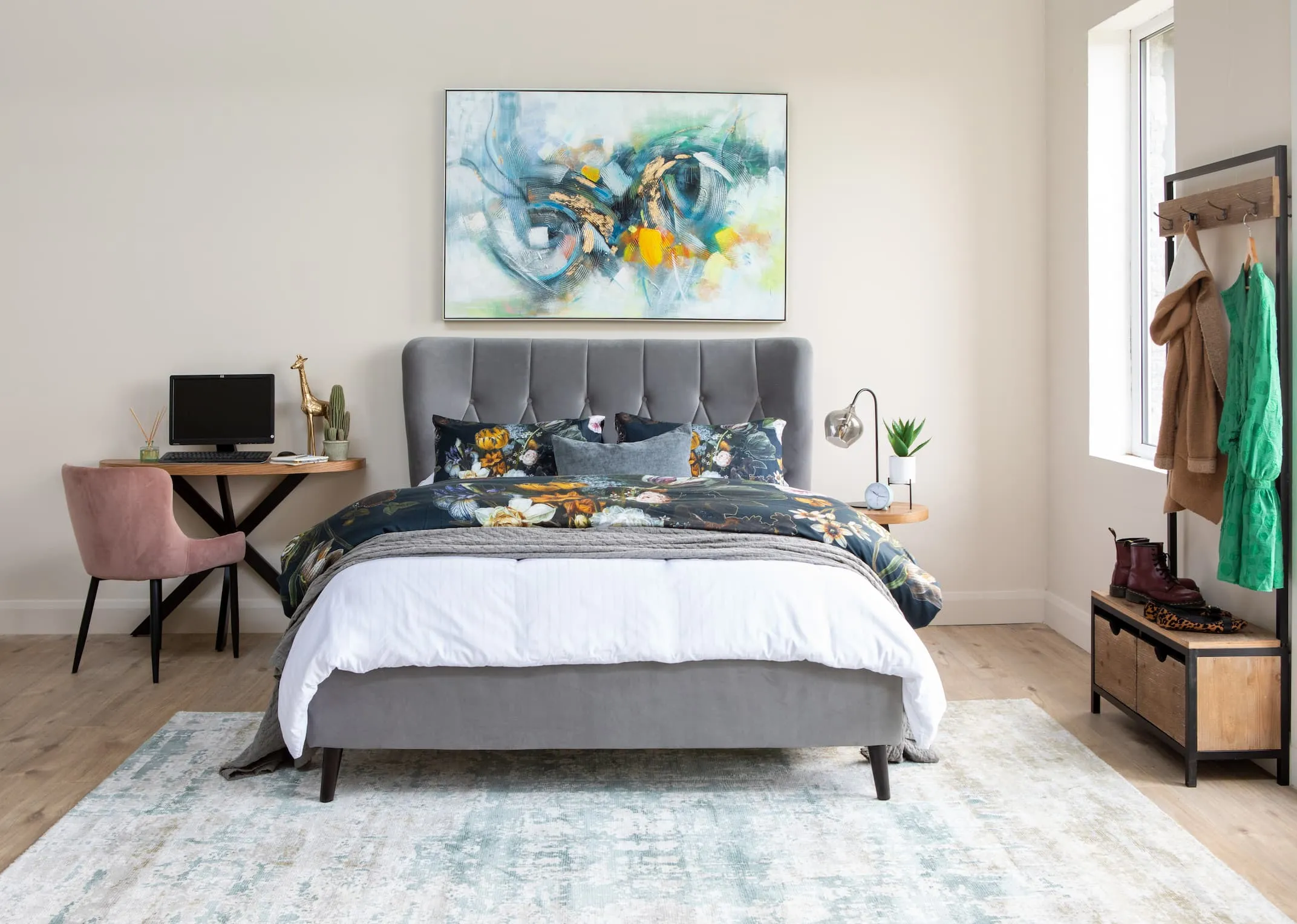 A lifestyle image of the Silver Garcia bed with ottowa chair & ellipse console and infusion print.