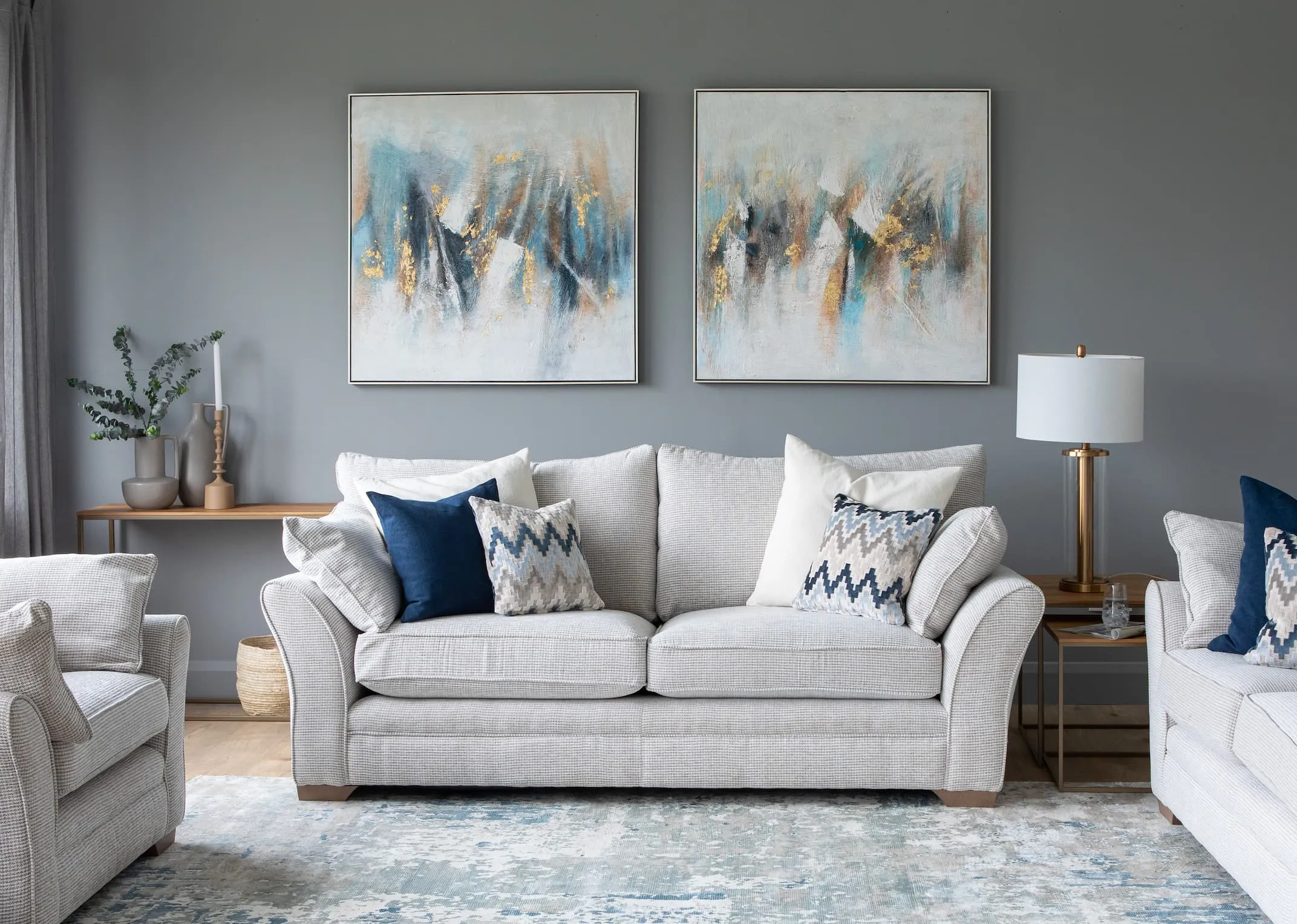 A 3 seater beige accent fabric sofa from EZ Living Furnitures Strata range.