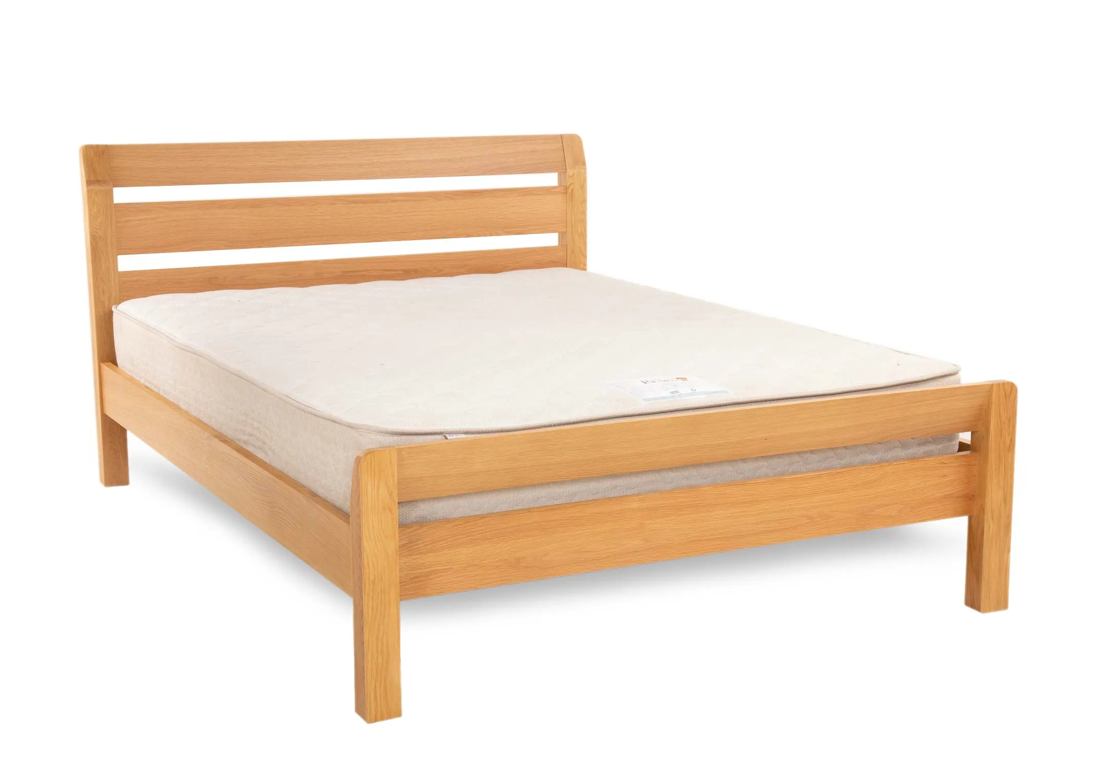 A 5ft king size oak bed frame from EZ Livings Iris range. Angled view of bed with mattress