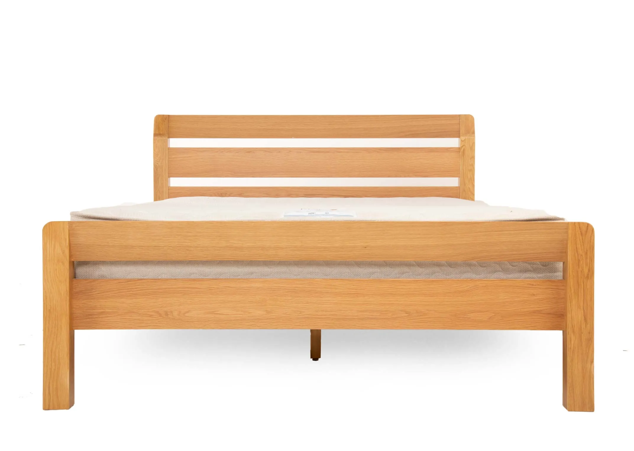 A 5ft king size oak bed frame from EZ Livings Iris range. Front view of double slat footboard & high headboard