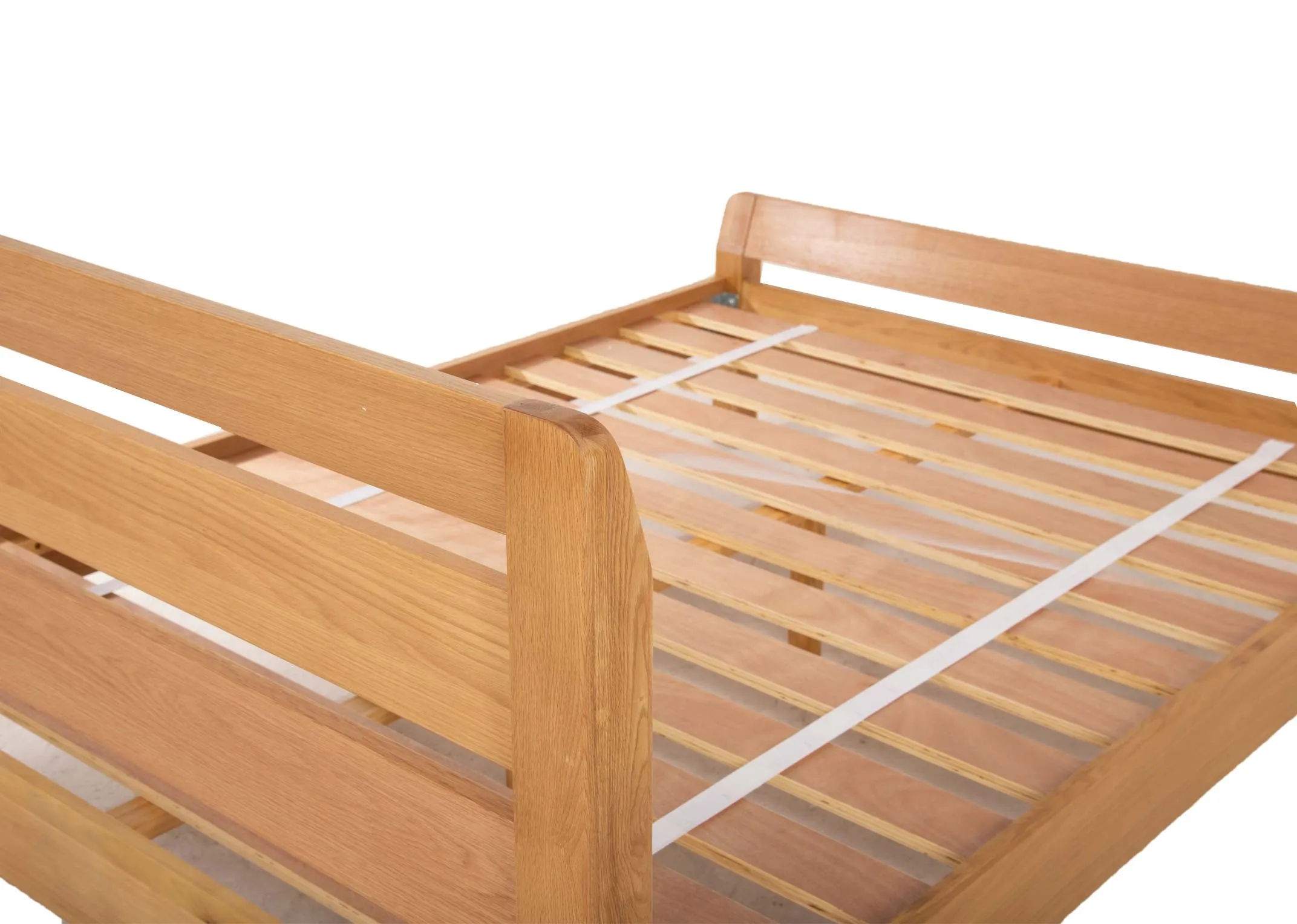 A double 4ft6 oak bed frame from EZ Livings Iris range. Side view of bed with mattress