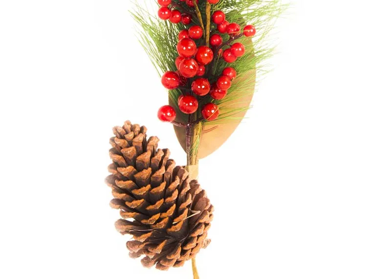 A green leafy pick with pine cone and red berries from the EZ Living Christmas range. Closeup of leafy foliage