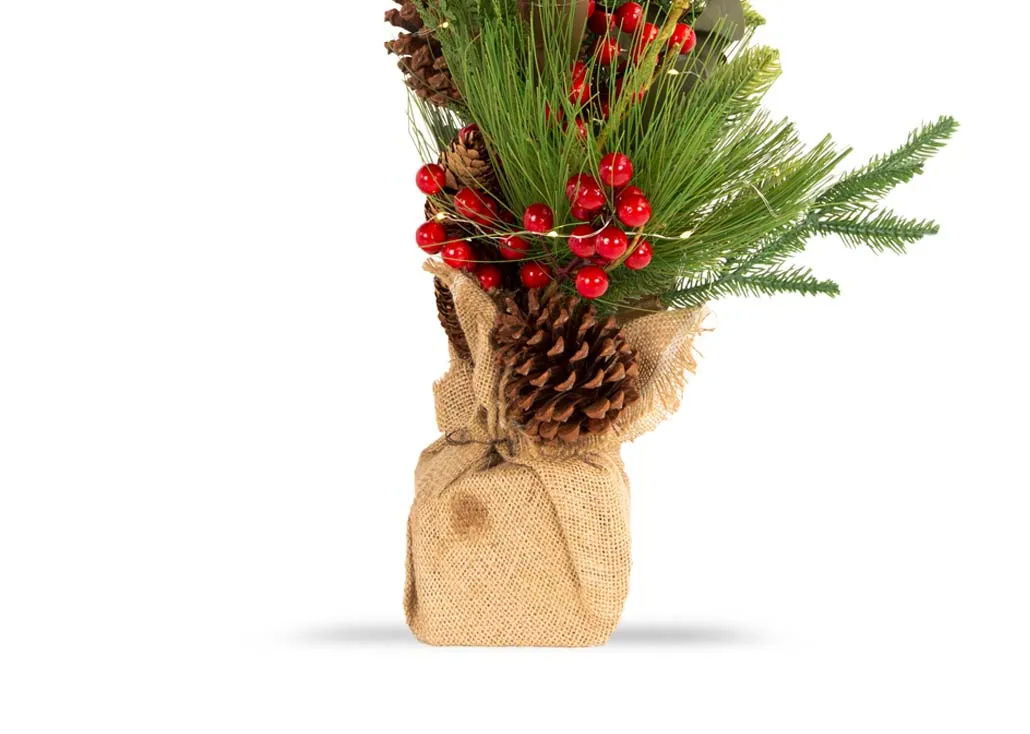 A small pine cone & berry artificial tree in a burlap sack from EZ Livings Christmas range. Closeup of pine cones