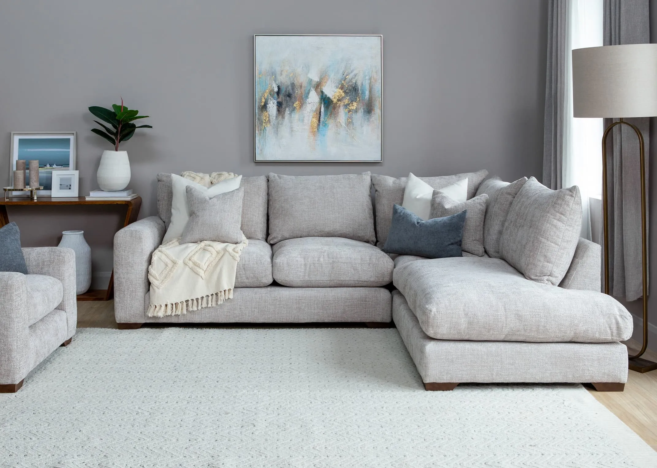 A lifestyle image of the Aurora LHF Corner Sofa with Abstract canvas.