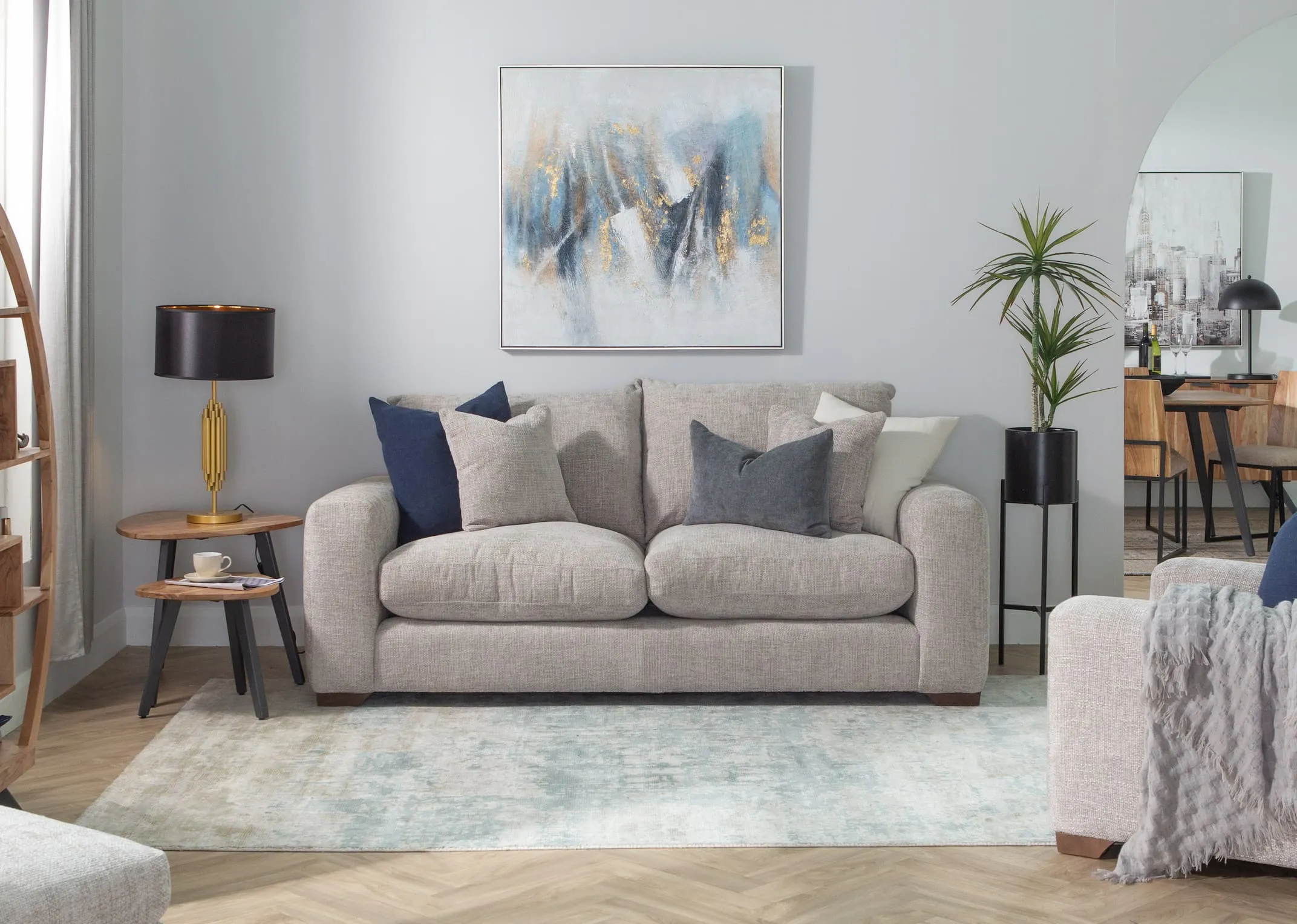 A lifestyle image of the Aurora 3 seater sofa with malta nests & modesto rug