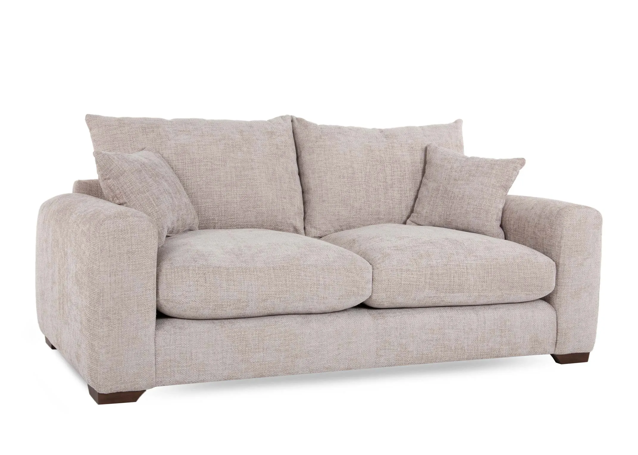 A beige fabric 3 seater sofa from EZ Livings Aurora range. Angled view of plump back cushions & 2 scatters