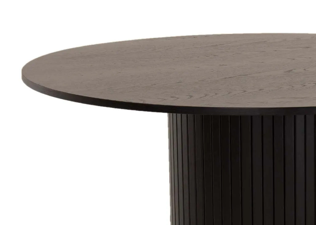 A large round black dining table with a slatted base from EZ Livings Nola range. Closeup of oak finish