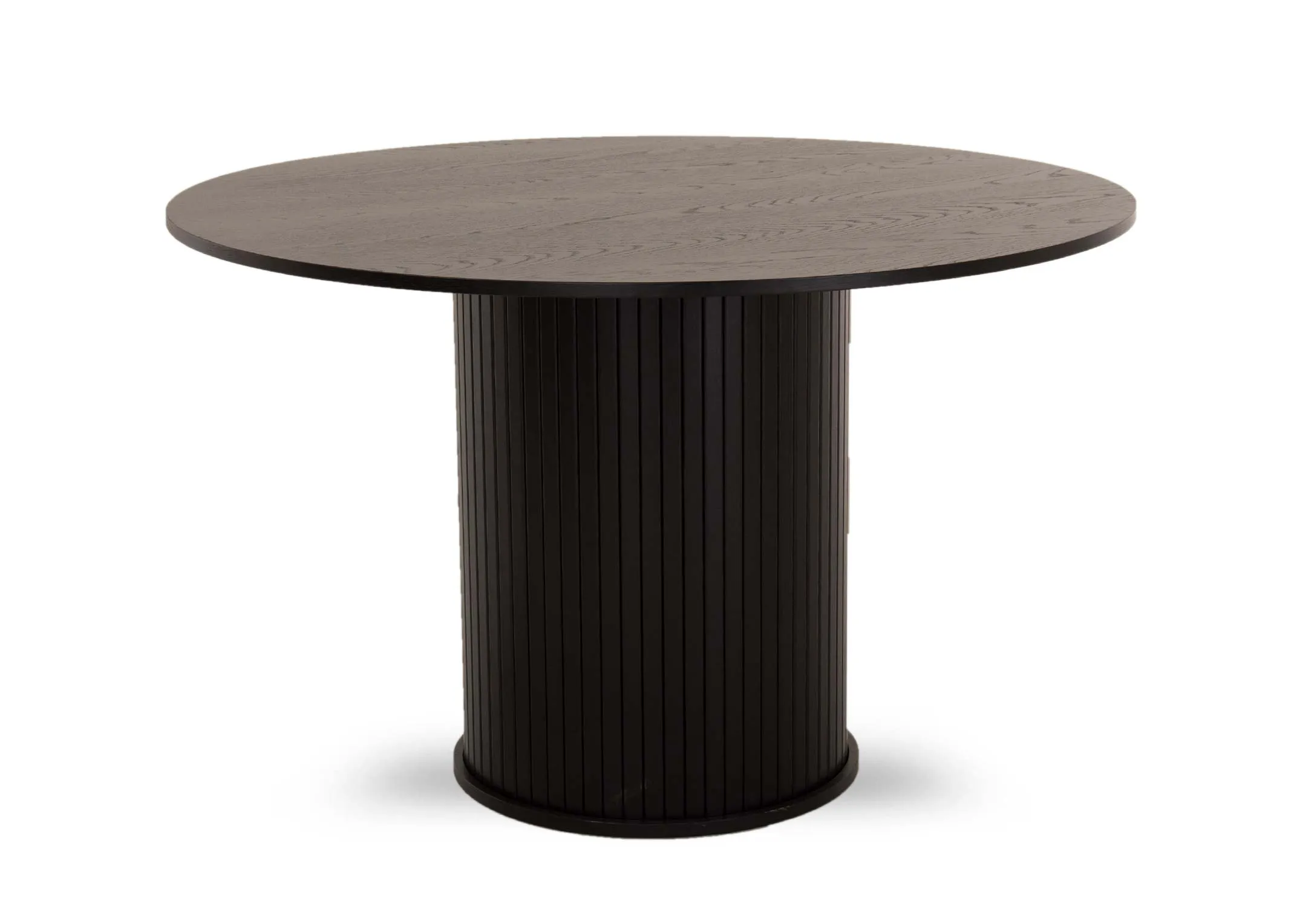 A large round black dining table with a slatted base from EZ Livings Nola range. Angled view of sleek slim table top and slatted finish.
