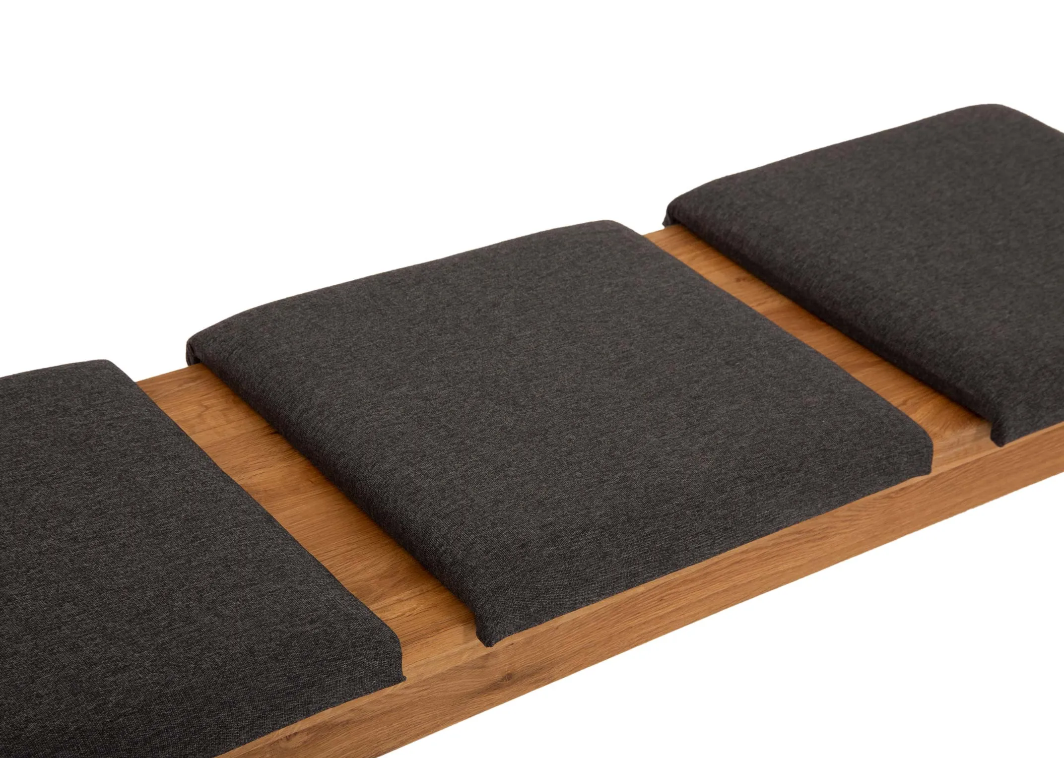 A square grey fabric padded seat from EZ Livings Como range. Angled view of 3 pads on bench